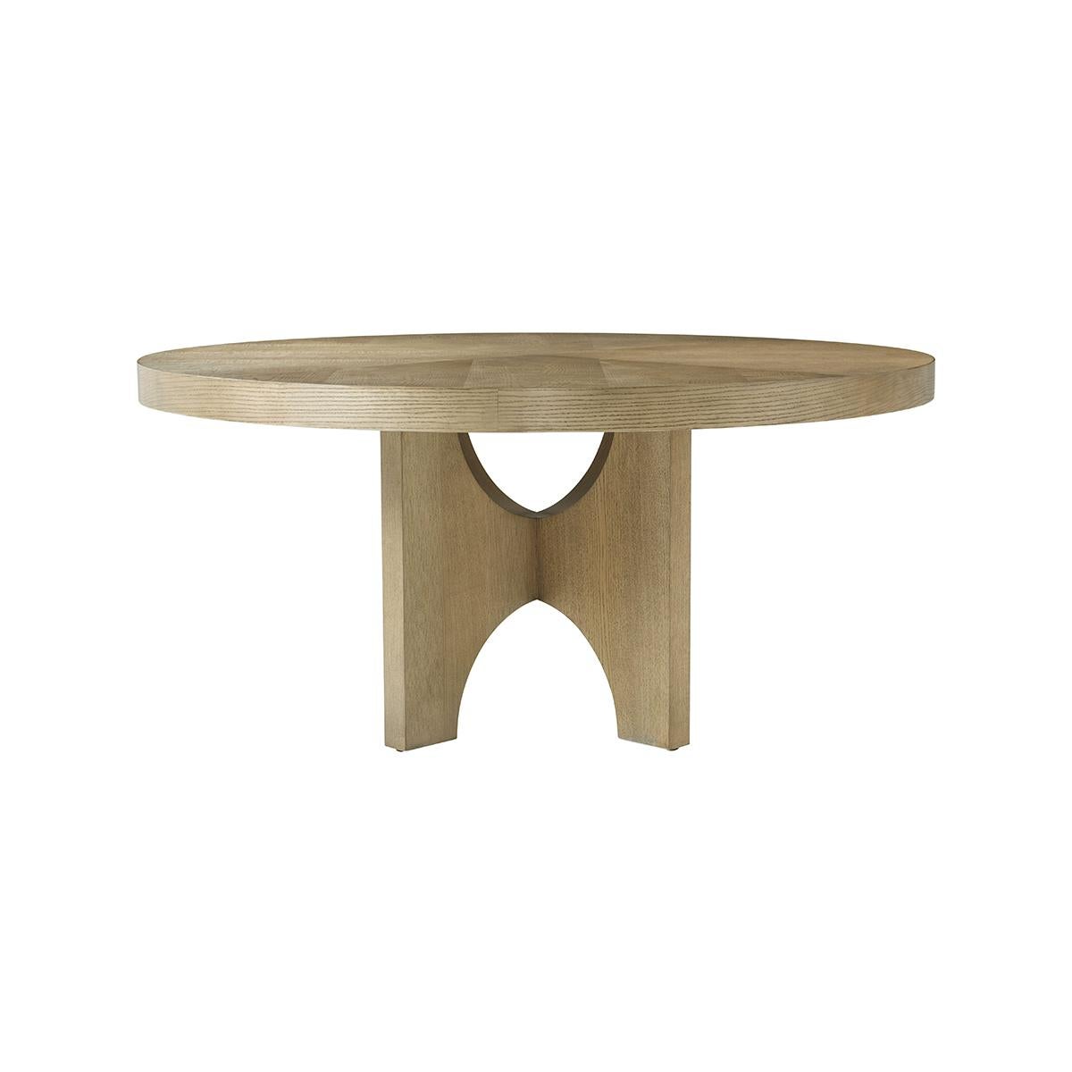 Modern Light Ash Dining Table, crafted from premium-figured cathedral ash in the Dune finish, this dining table boasts a rich texture and a sleek, light finish that adds a touch of elegance to any dining room. The round shape of the table invites an