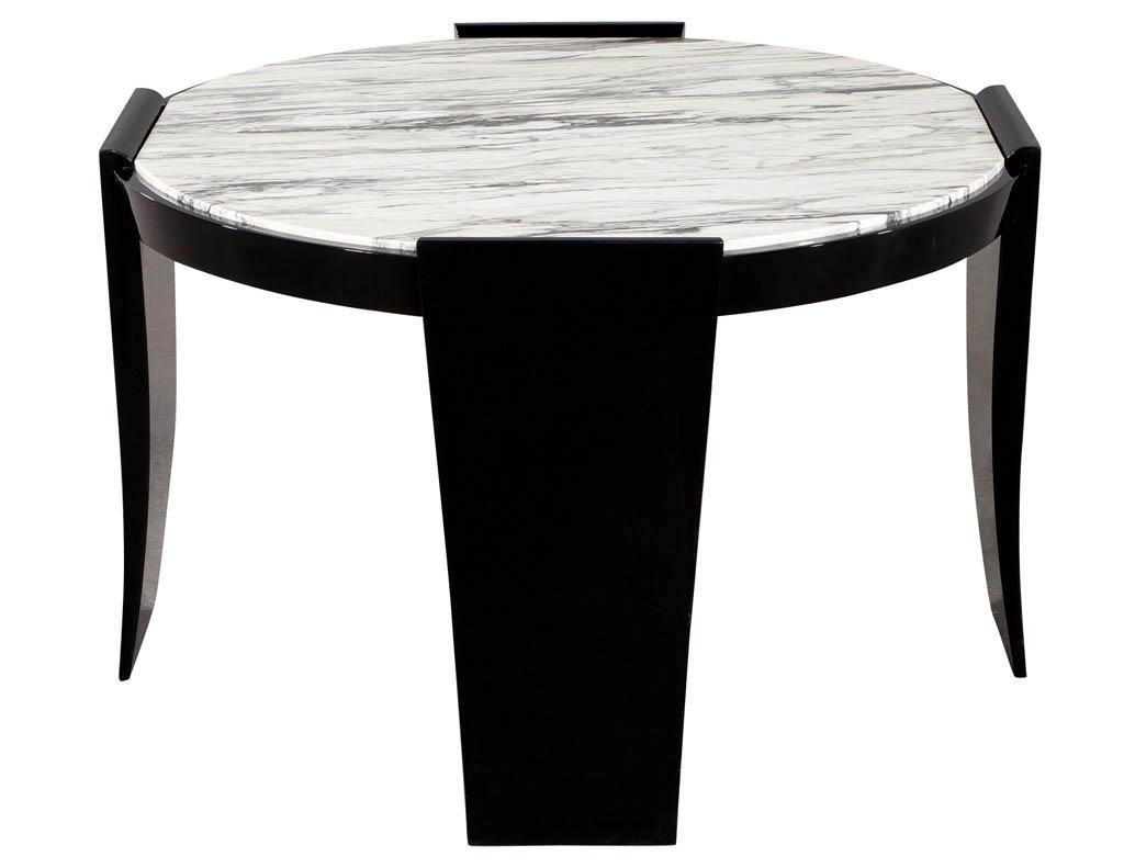 Modern round marble top foyer table. Featuring stunning 2-tone marble top with sleek hand polished black lacquer finish. Beautiful curved legs with smooth design features. A perfect piece for an entrance way.

Price includes complimentary curb