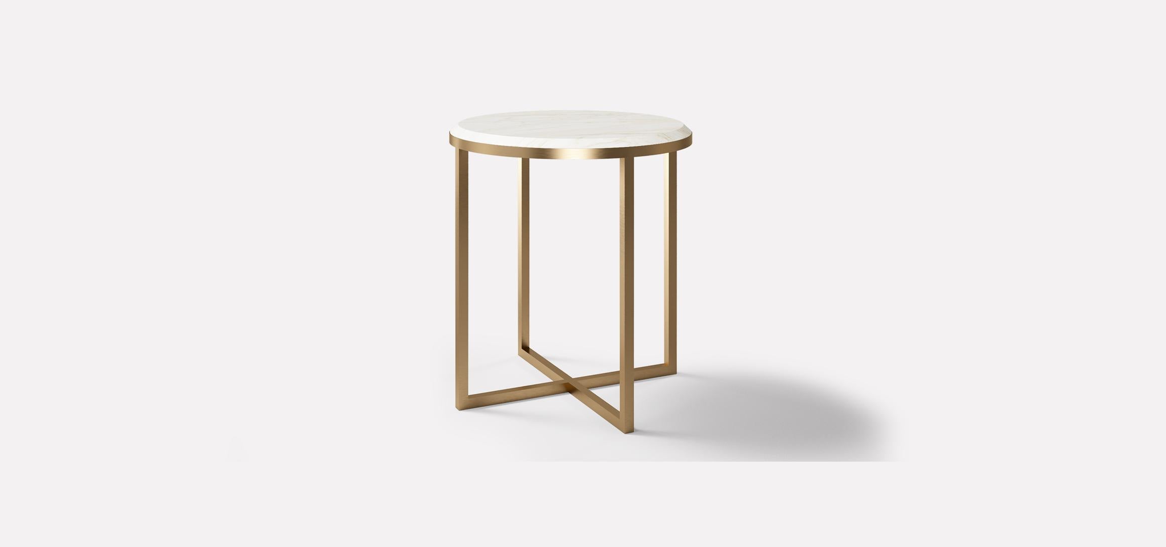 HOPE Royal is a side table with a round-shaped top and crossed straight metal base seamlessly welded and finished. The top is a precious marble perfectly beveled and carved, letting the beauty of material being the design protagonist of this