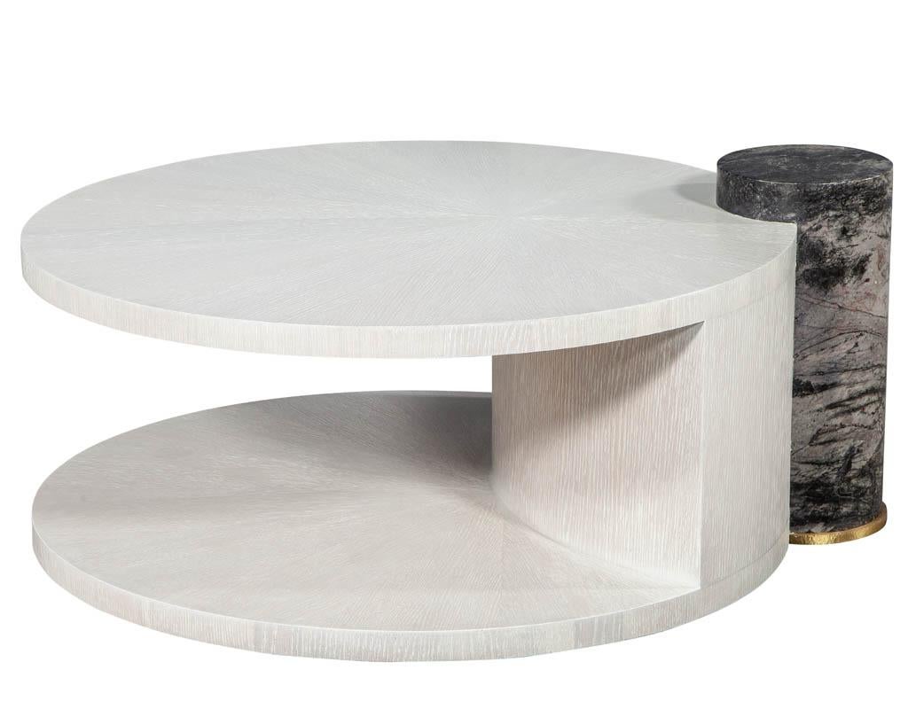 Modern round oak cocktail coffee table with Marble Pillar. Featuring sunburst oak top and marble column.

Price includes complimentary curb side delivery to the continental USA.

Measures: Height of wood top: 16.5” height of marble top: 18.5”.