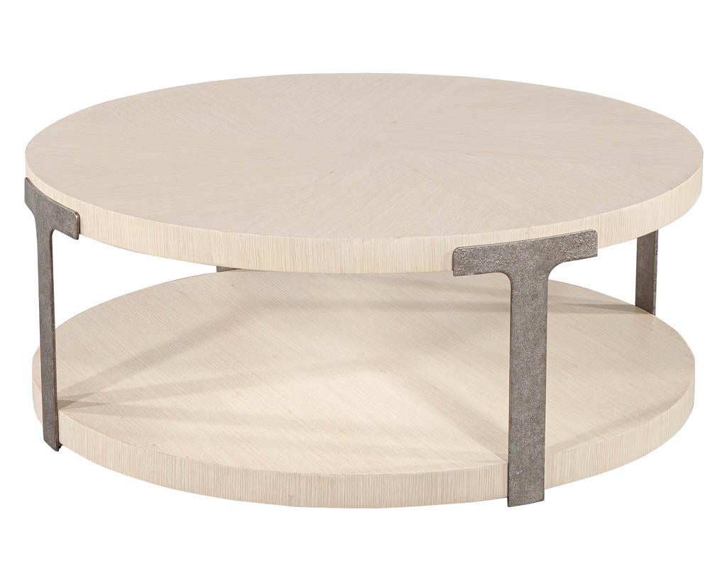 Modern round oak coffee table in sunburst pattern. Featuring natural bleached satin finished oak sunburst top with unique metal accent side supports.

Price includes complimentary curb side delivery to the continental USA.