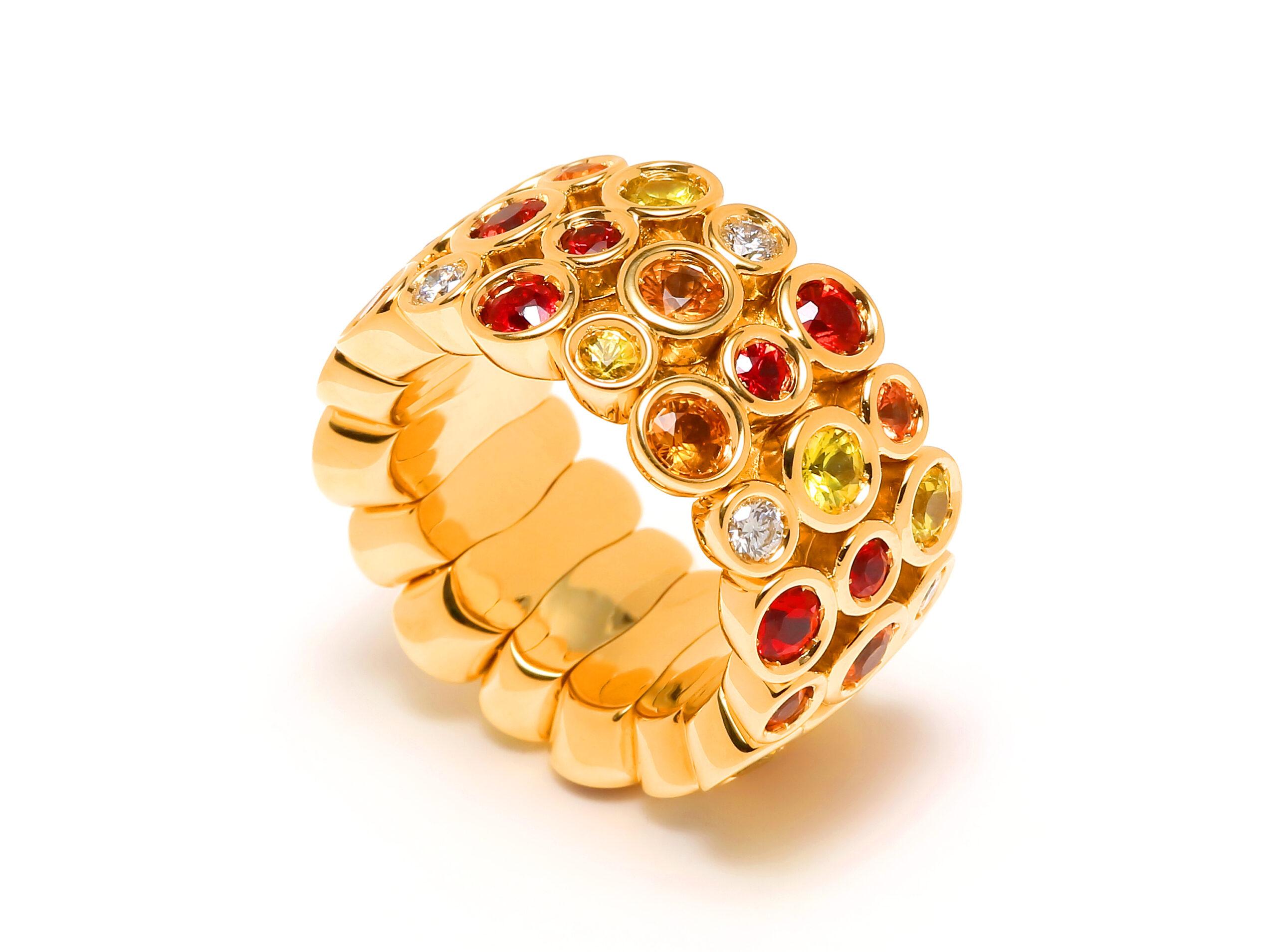 Multi Color Sunset Fire Eternity Patterns Ring

Red Ruby Orange Yellow Sapphire Diamond Eternity Band 18 Karat Yellow Gold Ring 

Jewels inspired by the colourful Art Deco movement. Lively designs and colorful Interpretations in a triple row