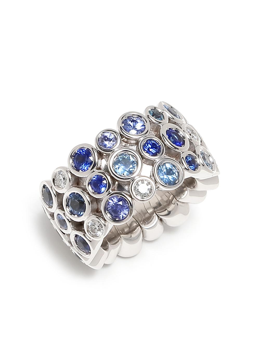 Multi Color Blue Eternity Patterns Ring

Blue Sapphire Diamond Flexible Bezel Eternity 18 Karat White Gold Ring Band

Jewels inspired by the colourful Art Deco movement. Lively designs and colorful Interpretations in a triple row eternity band