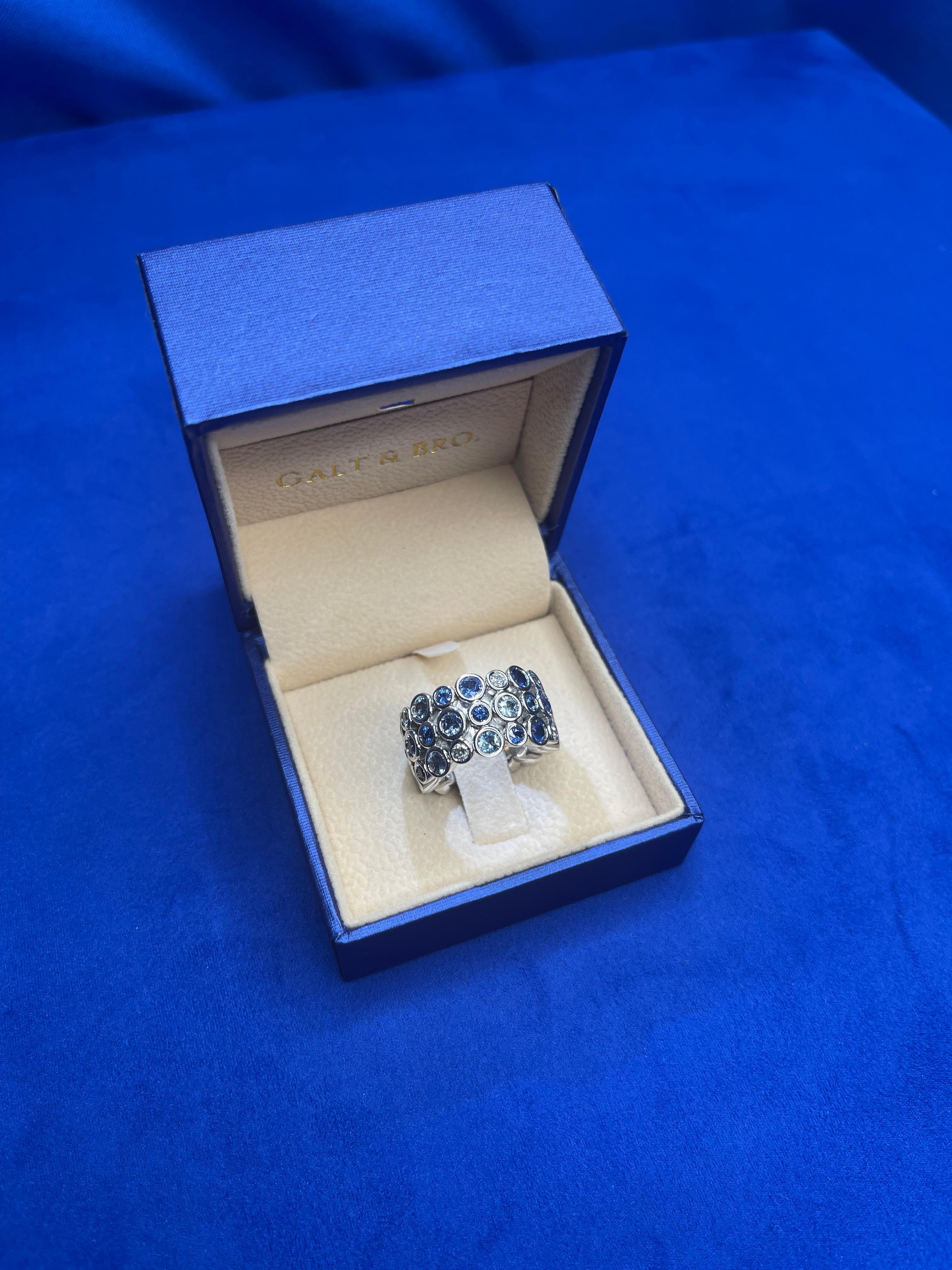 Round Cut Blue Sapphire Sky Topaz Diamond Flexible Bezel Eternity 18K White Gold Ring Band For Sale