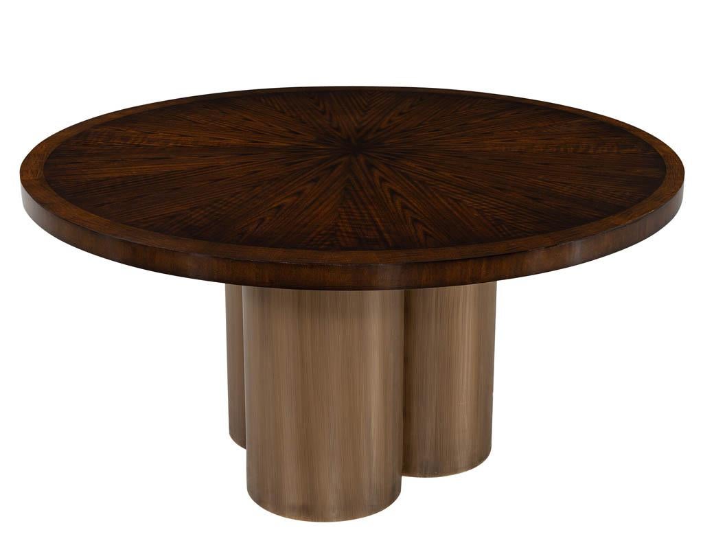 Modern round sunburst dining table in high gloss polished finish. Beautiful cherry wood top in unique sunburst grain pattern design. Finished in a rich warm brown high gloss hand polished lacquer. Completed with antiqued brass metal clover