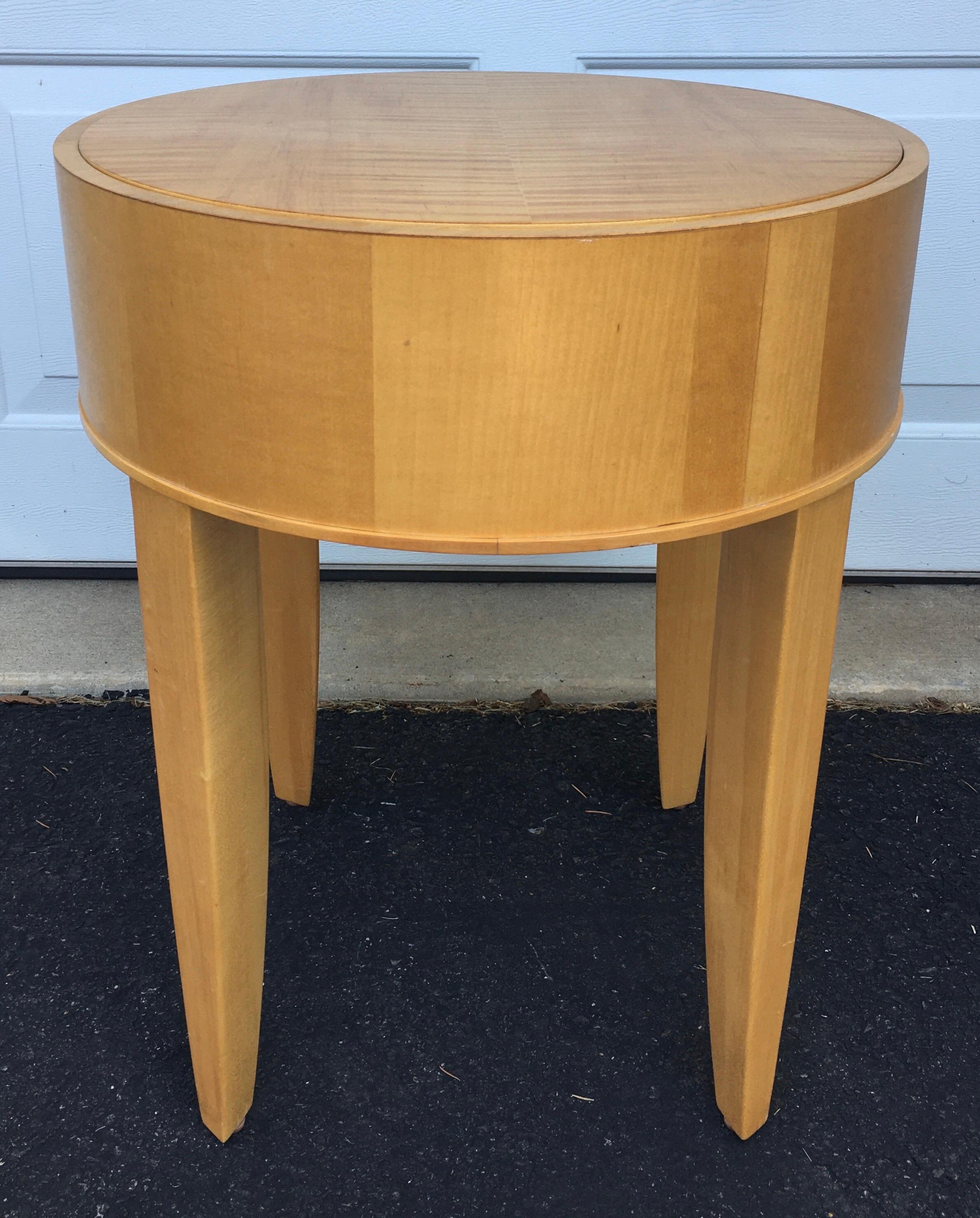 Round modern side table by Brayton International. This modern end occasional drinks tables features a natural tone maple wood veneer. Original manufacturers label on bottom of table.