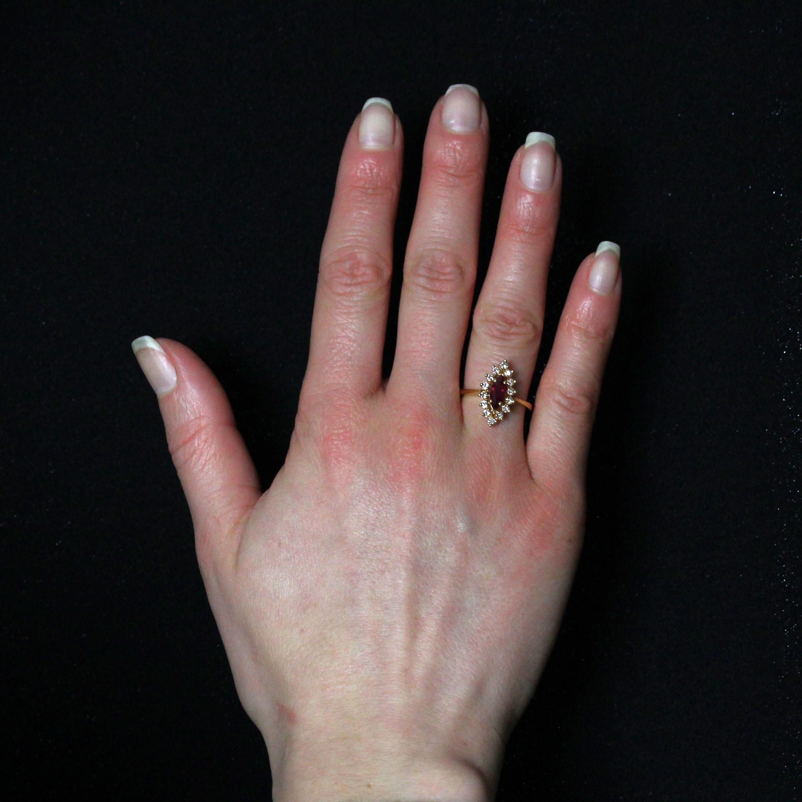Ring in 18 karat yellow gold, eagle head hallmark.
Ruby diamond second hand ring, its shuttle-shaped setting is adorned in the center with a probably treated marquise-cut ruby, held in 4 claws and surrounded by 14 modern brilliant-cut diamonds. The