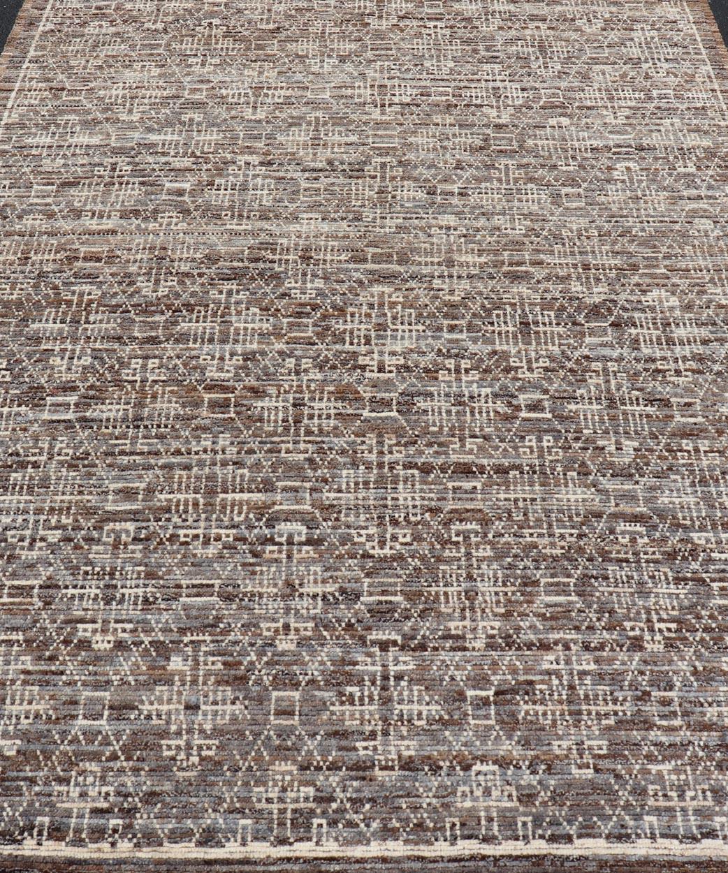 Modern Rug in Wool with All-Over Geometric Tribal Design in Brown and Ivory. Keivan Woven Arts /rug SNK-2307, country of origin / type: Afghanistan / Modern Casual, circa Early-21th Century.
Measures: 6'10 x 9'7 
 The rug features a modern all-over
