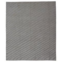 Moderner moderner Teppich aus Wolle mit subgeometrischem, geschwungenem, linearem Design in Creme und Taupe