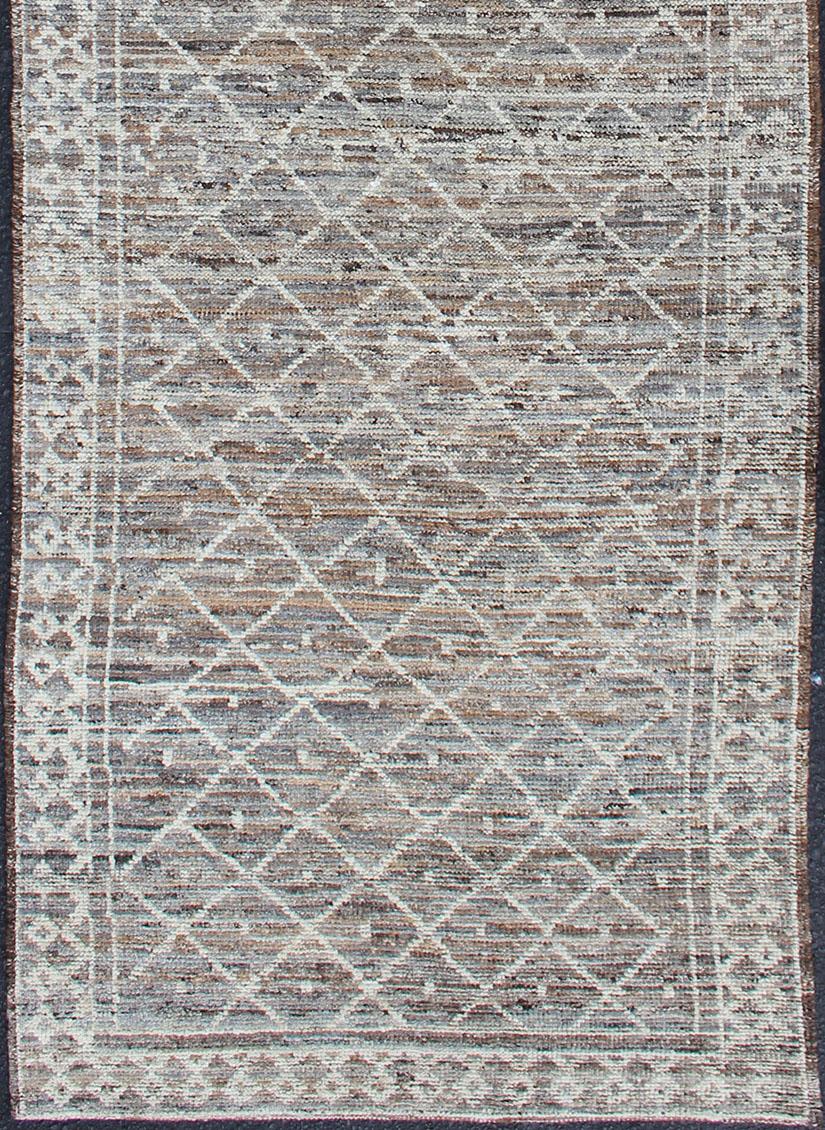 Neutral-toned variegated tribal design modern rug, rug AFG-33305, country of origin / type: Afghanistan / Modern, Modern Casual rug with tribal design in light gray, taupe, brown and naturals colors

This Modern casual rug features a Afghan Tribal