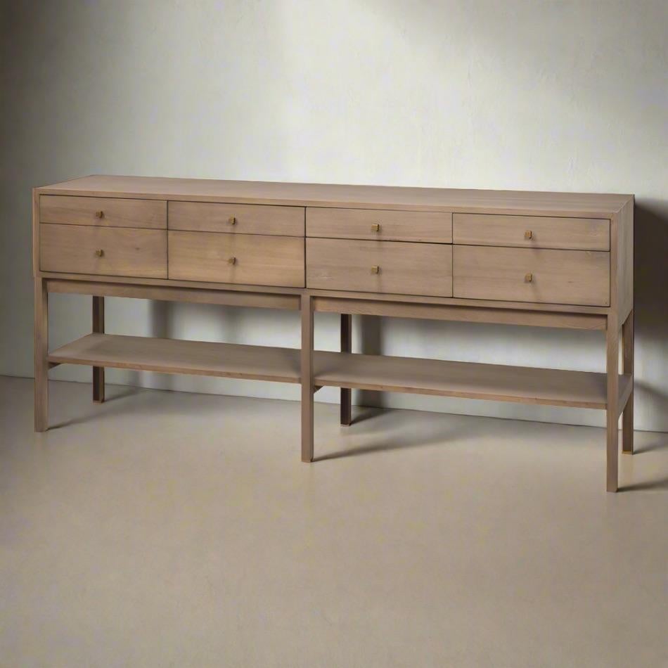 The light natural wash enhances the inherent beauty of new elm, creating a warm and inviting atmosphere in any space. 

Perfect for entryways, behind sofas, or as a display table. It is equipped with eight spacious drawers to keep your essentials
