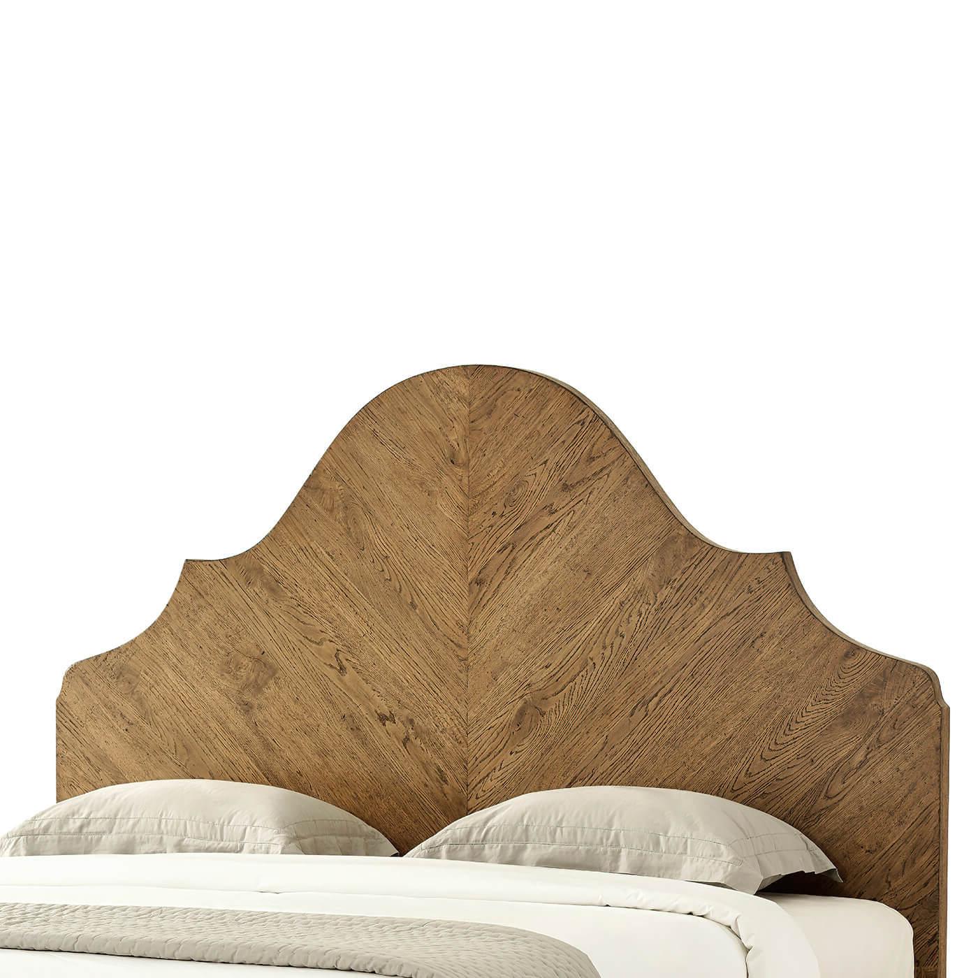 A modern rustic-style oak California king bed with an arched headboard. This artfully crafted bed has been hand-veneered. It has been crafted with rustic oak and is shown in our striking Dawn finish. 

Shown in dawn finish
For CAL. king mattress