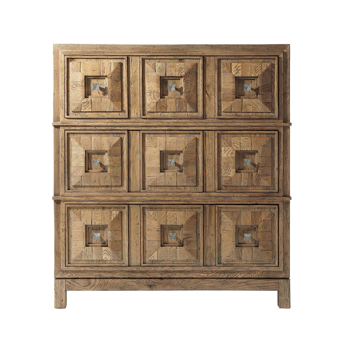 Modern rustic dresser in light echo oak finish, with planked parquetry top and sides. This dresser has three triple coffered drawers accented with vintage textured metal knobs. 

Dimensions: 40.75