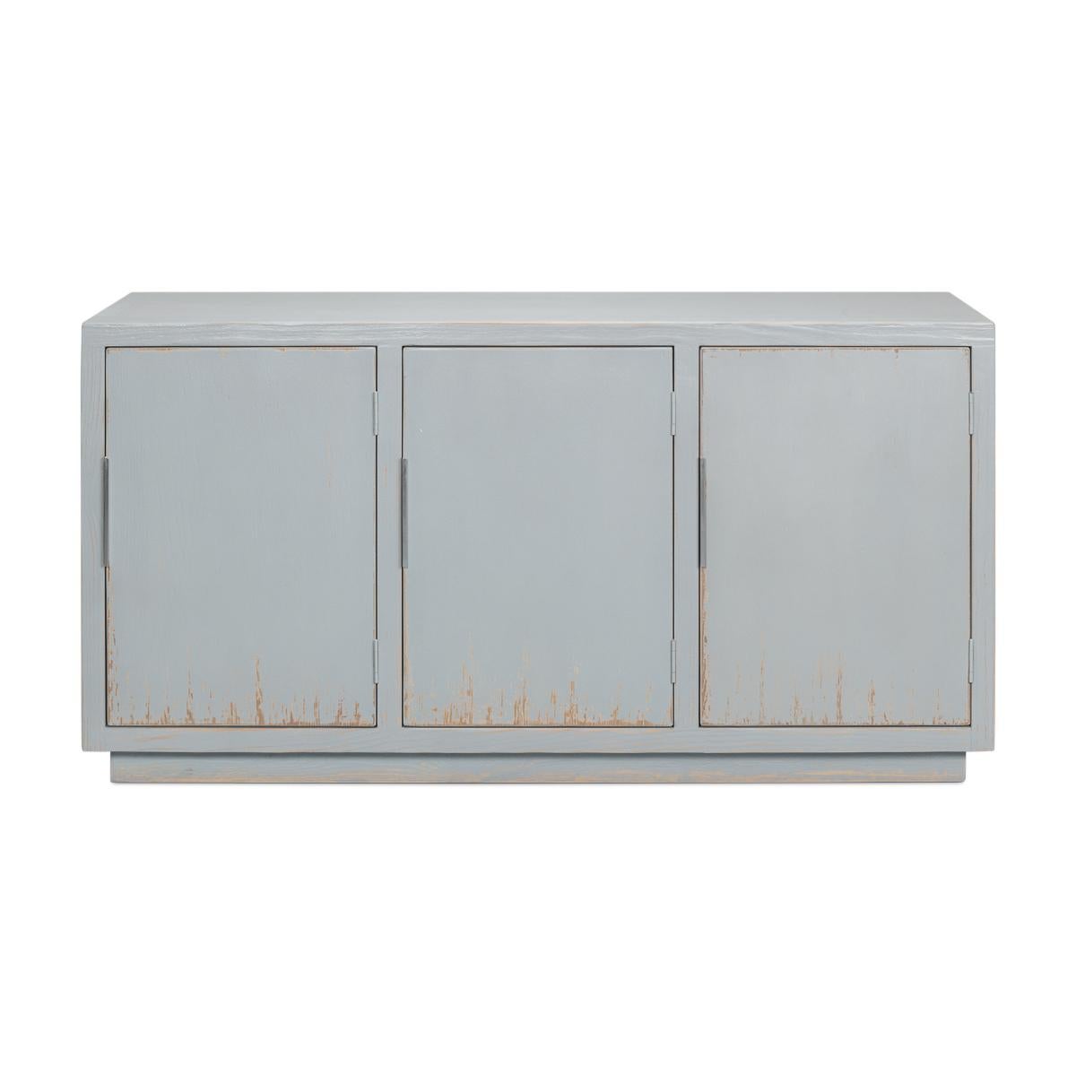 Modern Rustic painted sideboard in a light blue painted finish. This sideboard has been distressed and antiqued for a rustic feel. The doors fitted with contemporary hardware specifically selected to reflect the beautiful patina of the finish. The