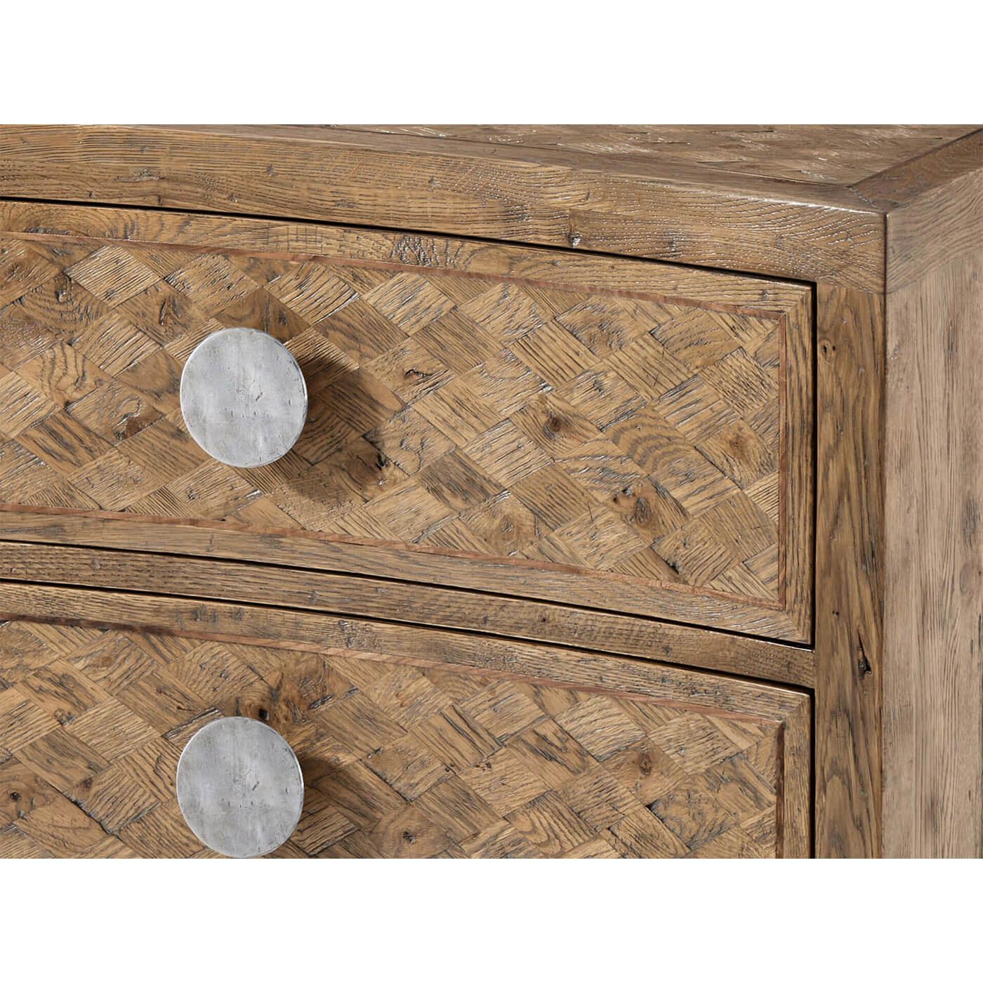 Modern rustic oak nightstand with diamond parquetry inlay, a concave front with two long drawers, on square tapered legs with large round vintage style metal pulls.

Dimensions: 36