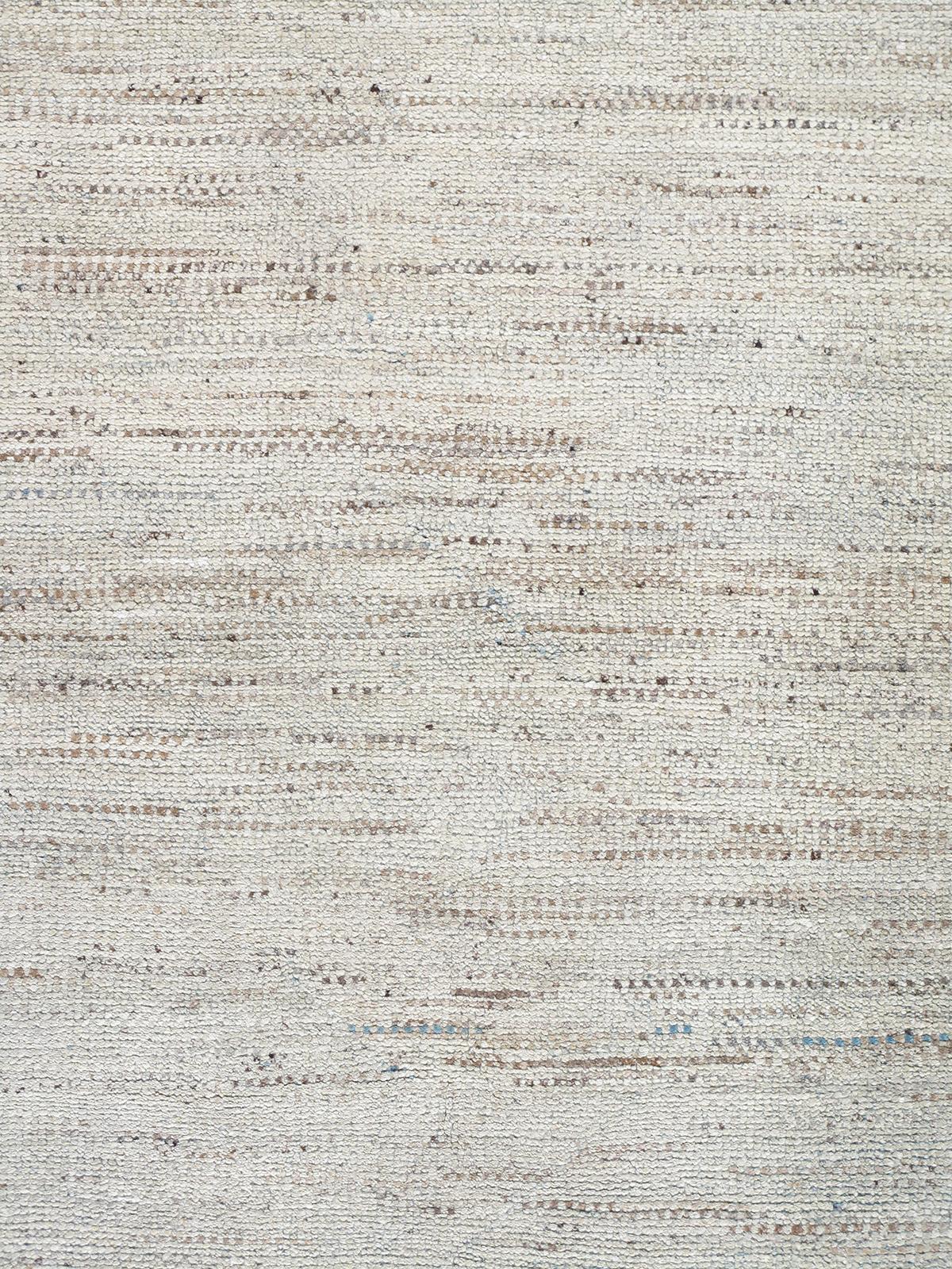 Our Sahara rug is handknotted from hand-spun, naturally dyed wool. The blue and beige modern design offers a minimalist approach with a discreet pop of color. Custom sizes and color specifications available upon request.