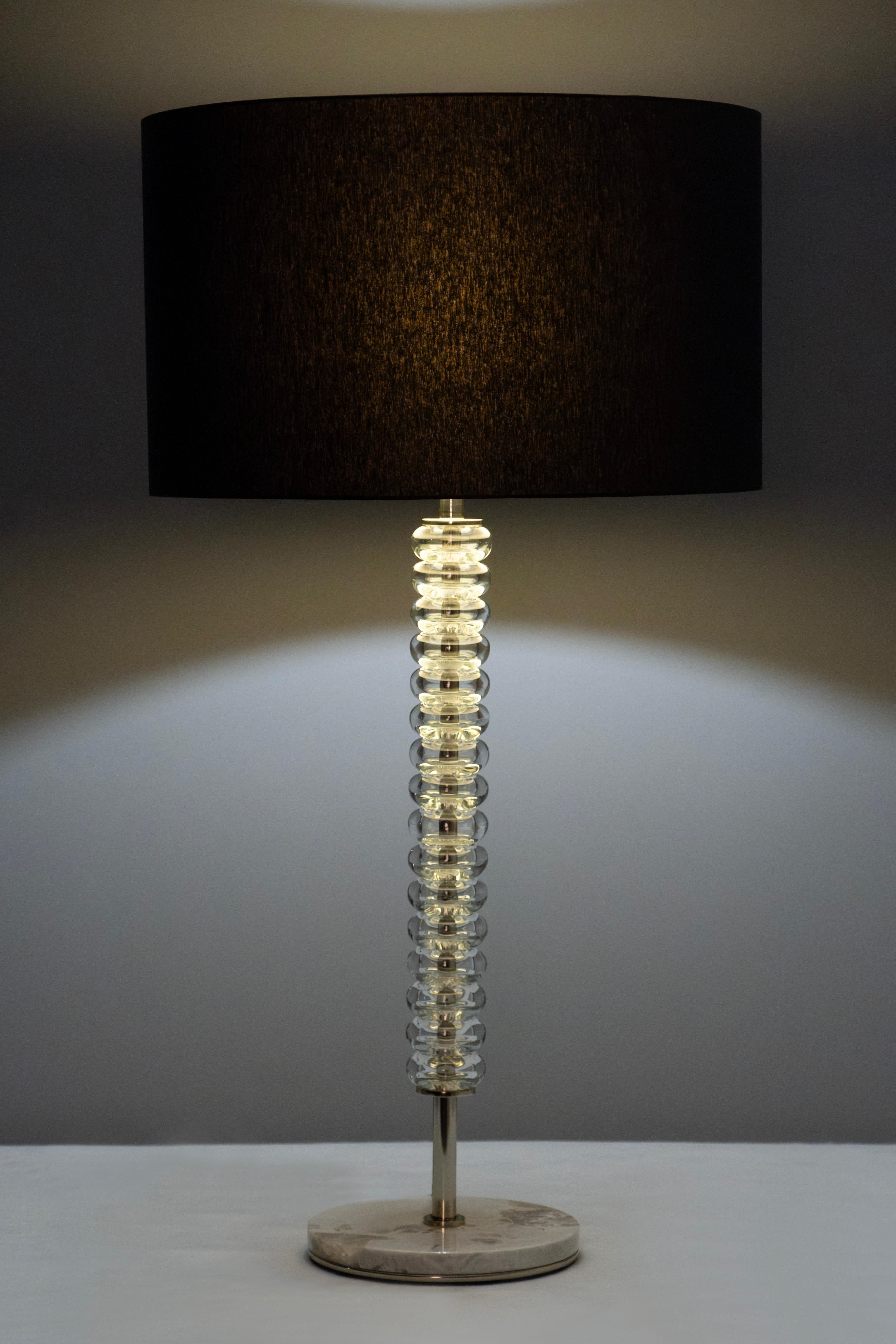 Saldanha Table Lamp, Modern Collection, Handcrafted in Portugal - Europe by GF Modern.

A luxurious table lamp, Saldanha creates the subliminal ambiance for exceptional living. The clear-glass spheres harmonize the wonderful contrast between the