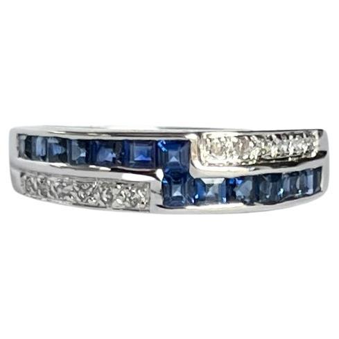 Modern Sapphire and Diamond 18 Carat White Gold Cross over Ring For Sale