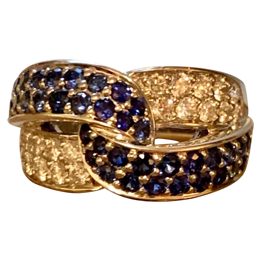 This beautiful fashion ring features a ribbon of 38-2mm bright blue, round, faceted Sapphires and 20-2.2mm brilliant cut Diamonds.  Total Diamond weight is estimated at .90cts.  Total weight of Sapphires is estimated at 1.5cts.  The ribbon of