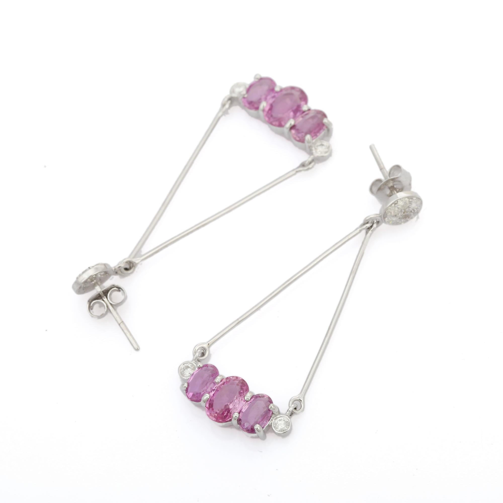 Modern Pink Sapphire Diamond Dangle Earrings in 18K gold to make a statement with your look. These earrings create a sparkling, luxurious look featuring oval cut sapphire.
Sapphire stimulate concentration and reduces stress.
Designed with round cut