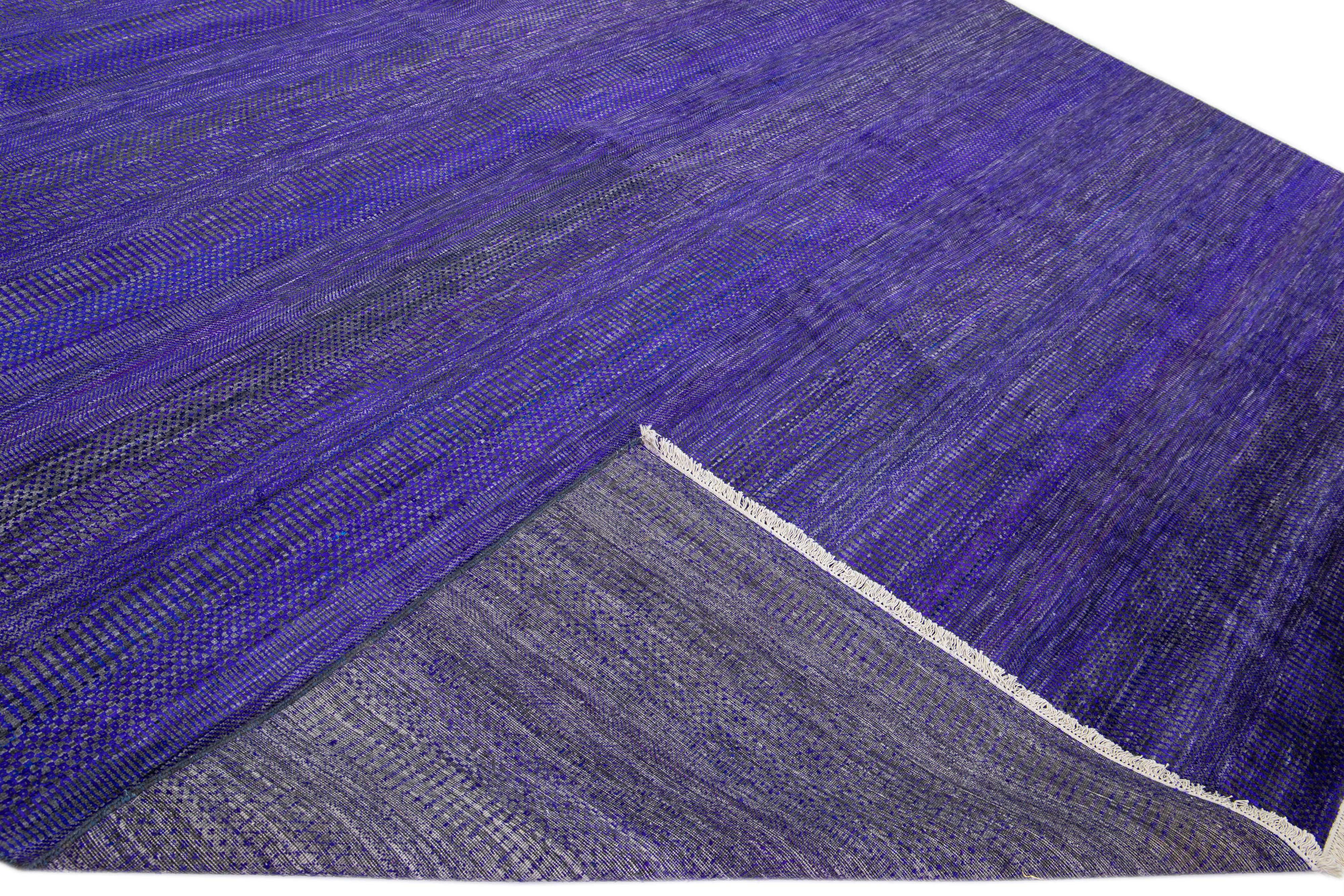 Beautiful Contemporary Savannah hand-knotted wool rug with a purple and gray field. This piece has an all-over geometric pattern design.

This rug measures: 12' x 17'10
