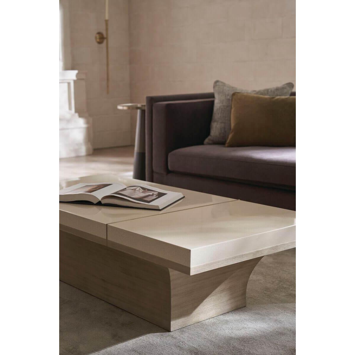 Cette table à cocktail témoigne d'une tension délicate entre la texture et le matériau. Il se compose d'un vaste plateau en finition craquelée Ivory Craze, équilibré par un socle en bois de Koto qui semble défier les lois de la gravité. Une