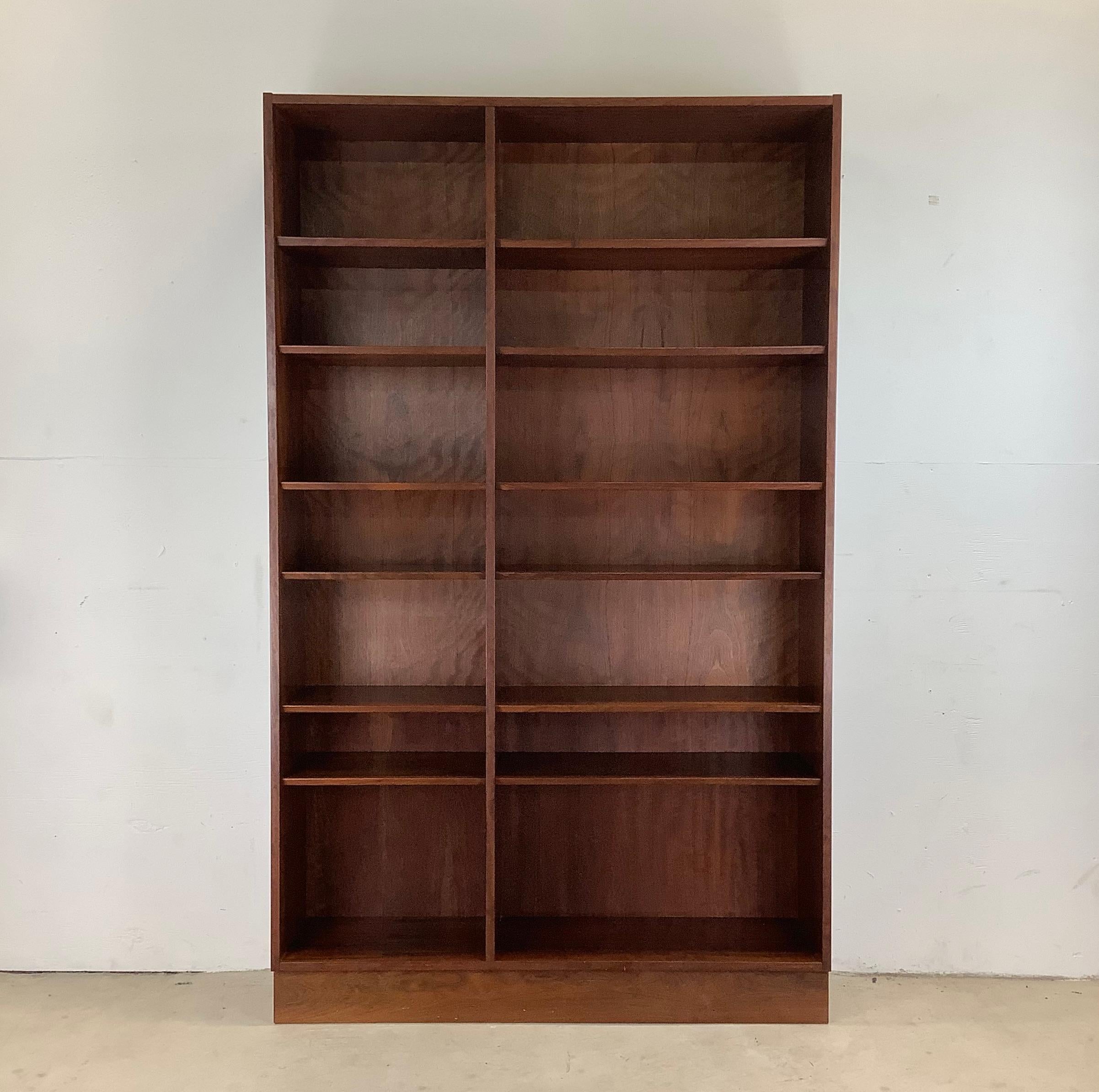 This impressive offset double bookcase boasts an impressive vintage rosewood finish, twelve shelves (ten adjustable), and at almost six and a half feet tall offers plenty of storage and display space for home or office. Matching single rosewood