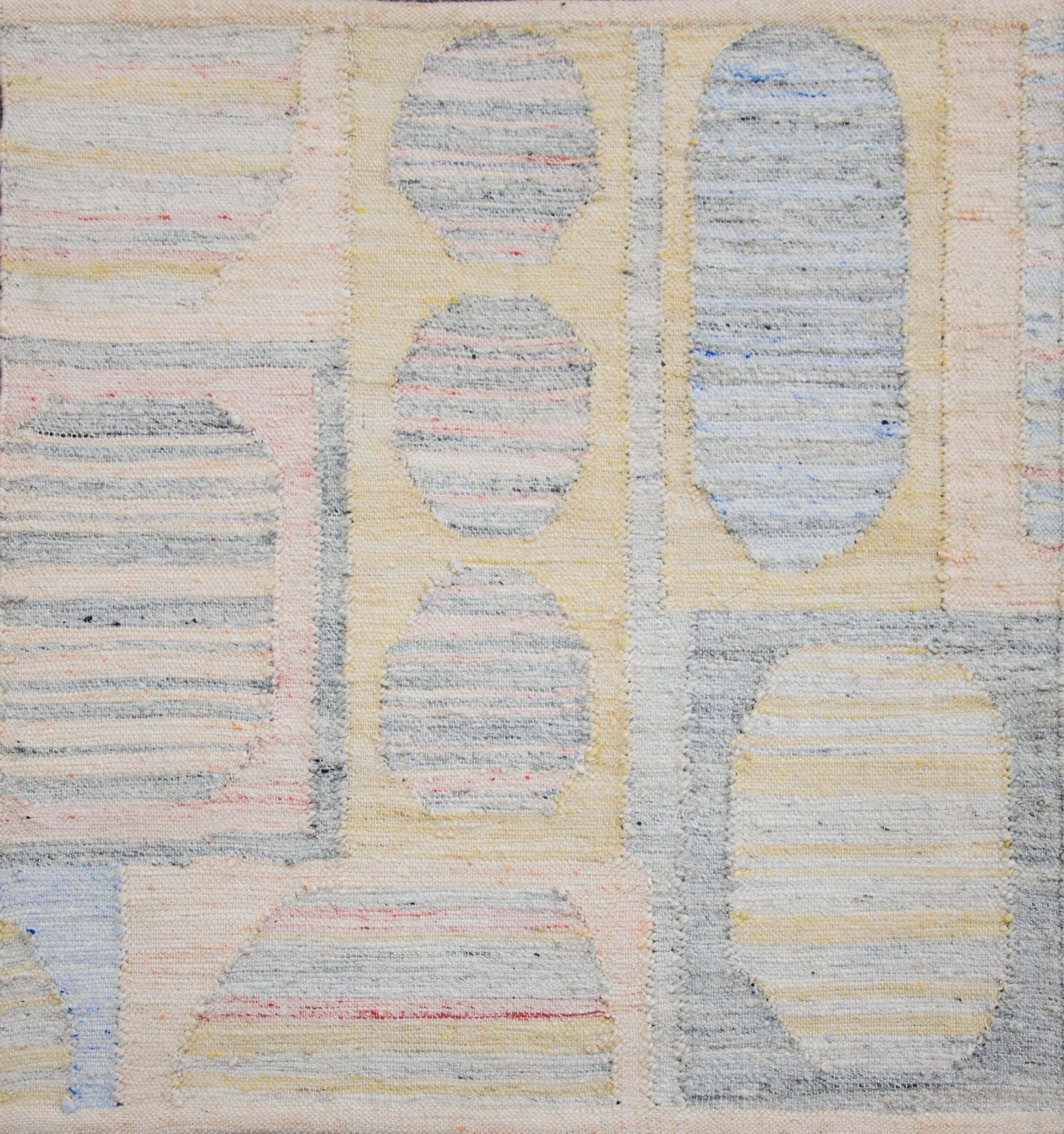 Modern area rug handwoven in Scandinavian design using fine wool and organic dyes. It features an exquisite gray striped field with colorful geometric patterns all-over. This piece will surely look fabulous in modern and contemporary interiors. It