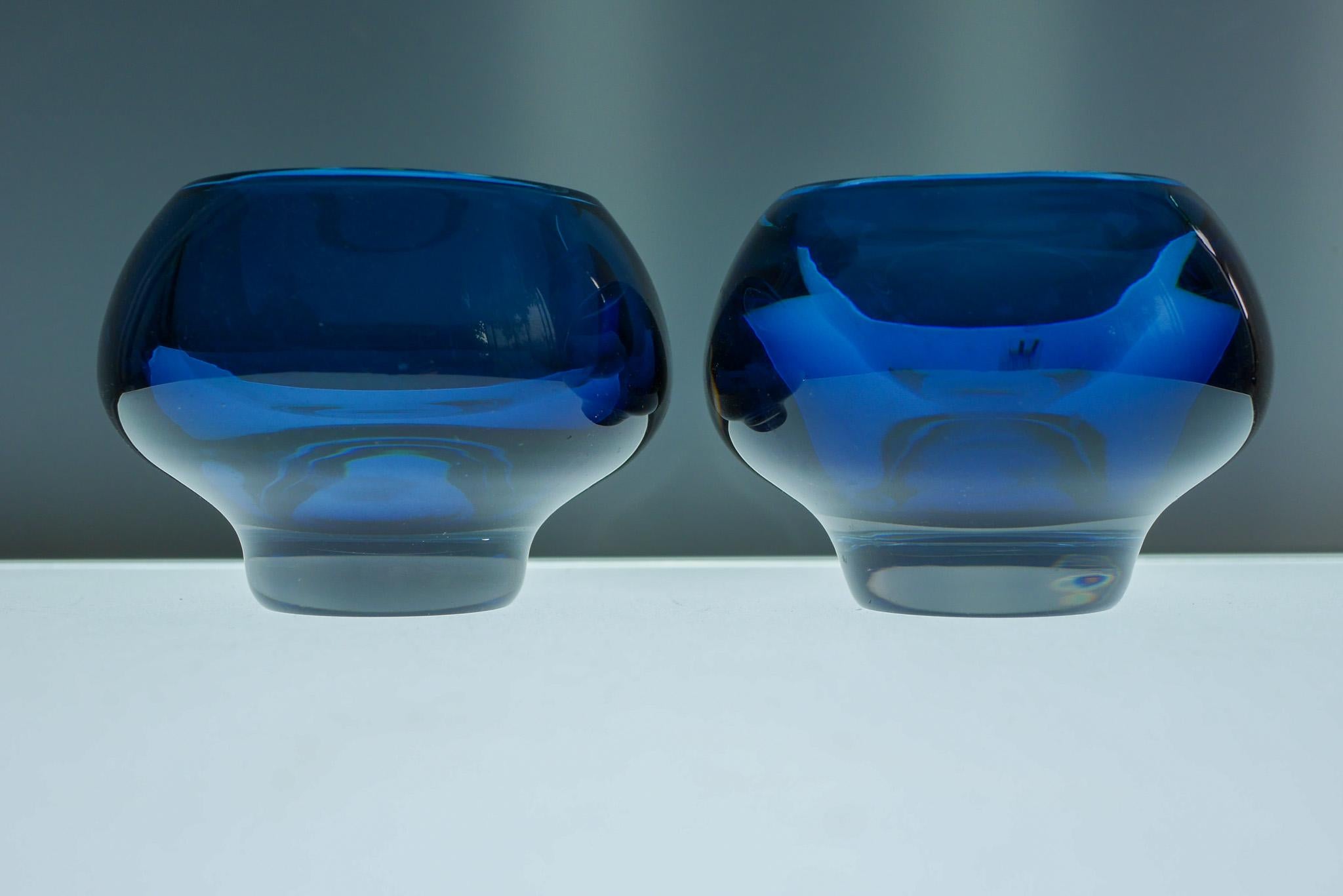 A pair of dark blue sommerso crystal glass bowls by Mona Morales Schildt. She is regarded as one of Sweden's most talented glass designers. Her objects can be seen in museums and art galleries all over the world. Her work always holds an extremely