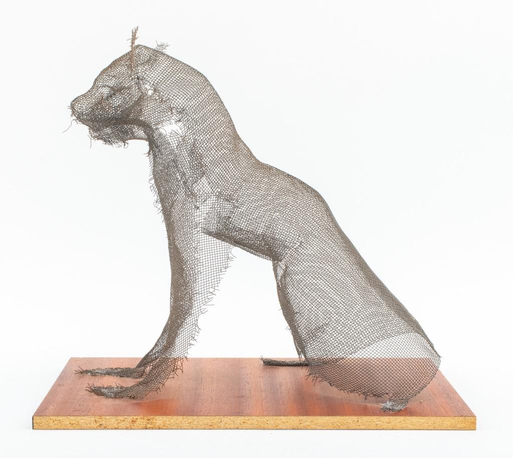 Modern upcycled art screen statue sculpture depicting a seated cat feline figure, mounted on a composite wood base.

Dimensions: 15.5