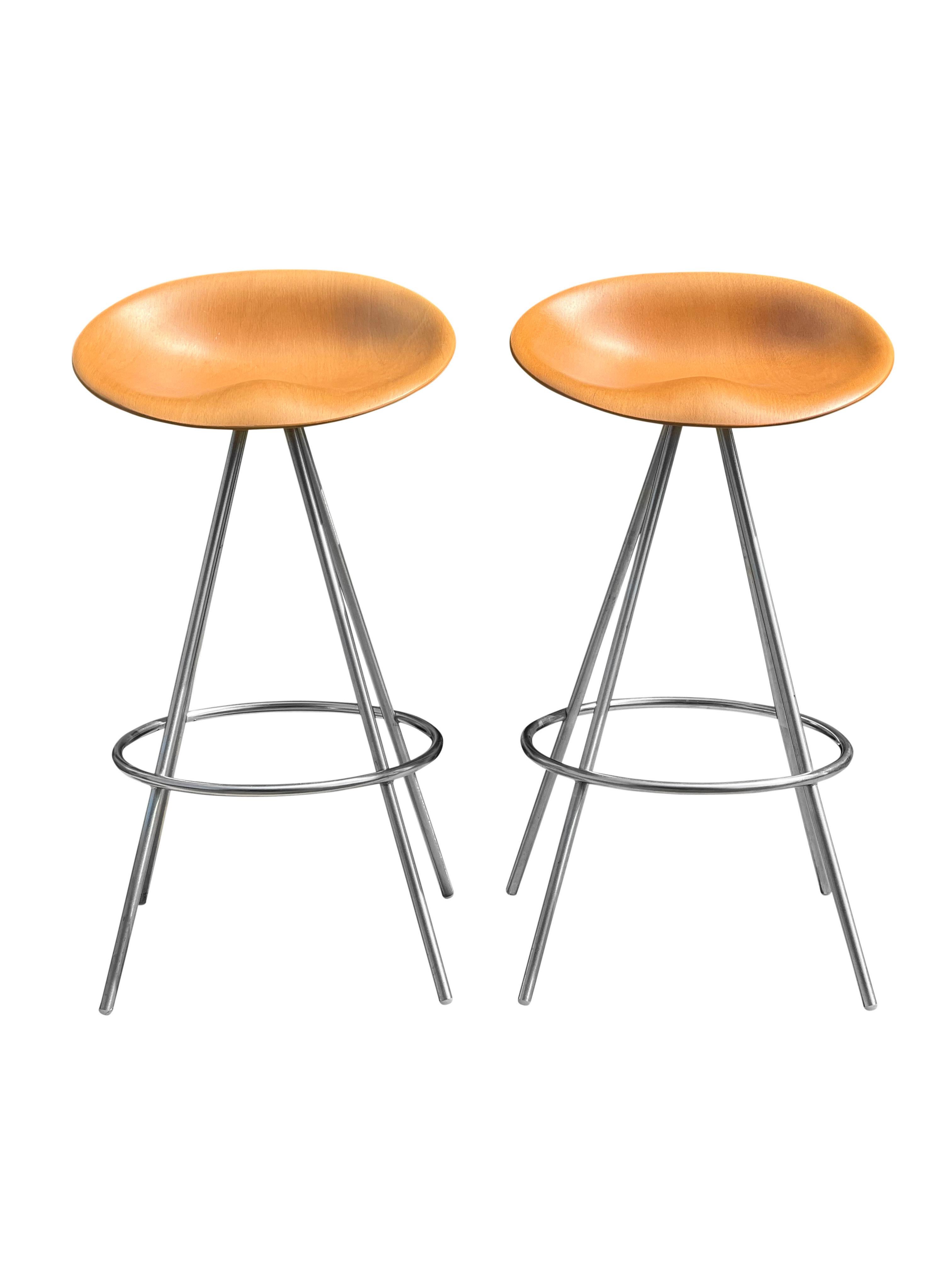 Sleek Jojo model barstools by Allermuir, England, 2008. The stools feature an elegant, curvaceous shell seat in laminated beech with a four-legged chrome base. A comfortable and versatile stool with a clean, minimalist profile. In very good,