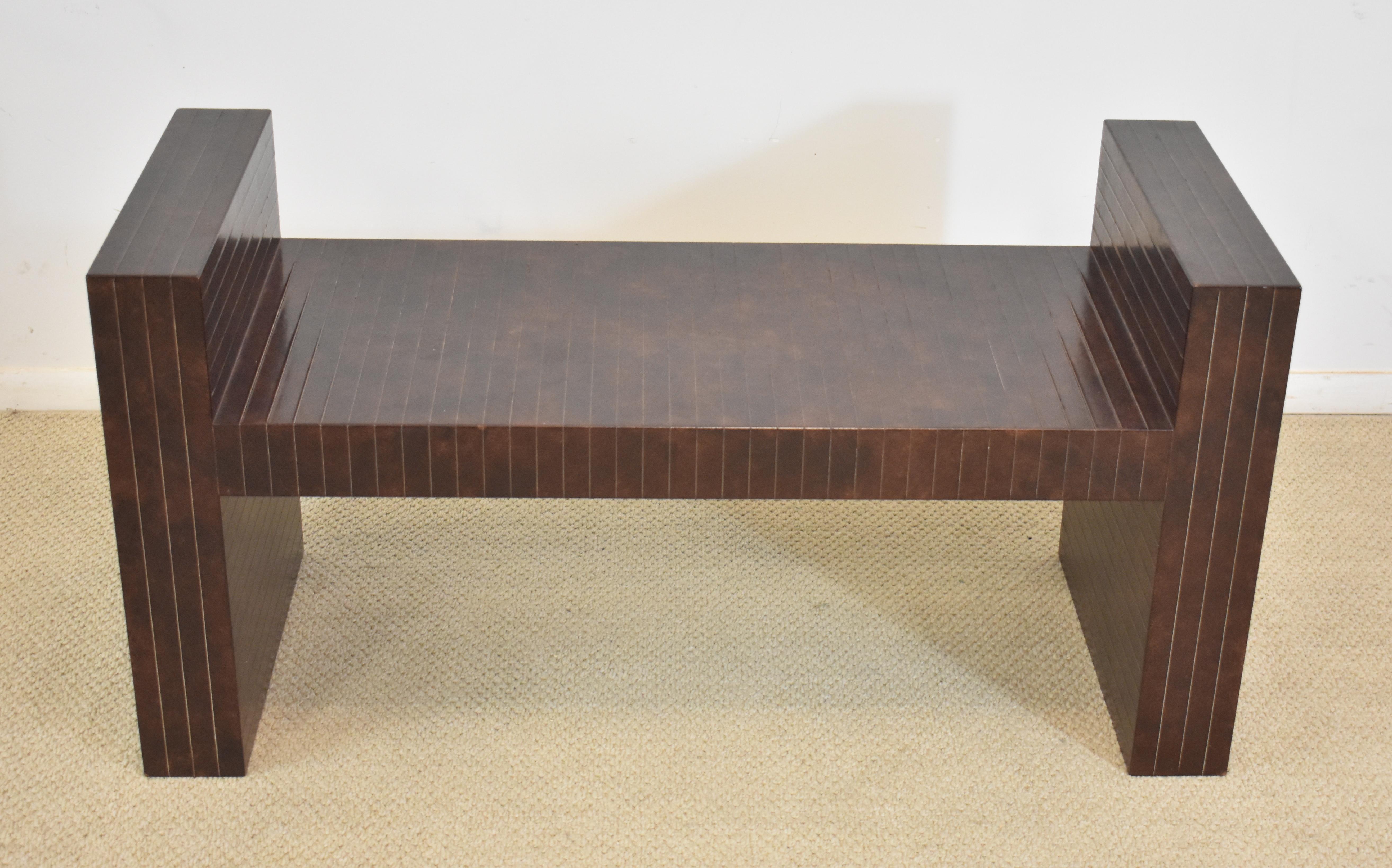 Mid-Century Modern sculptural bench clad in brown scored leather by Karl Springer. Very good condition. Dimensions: 18