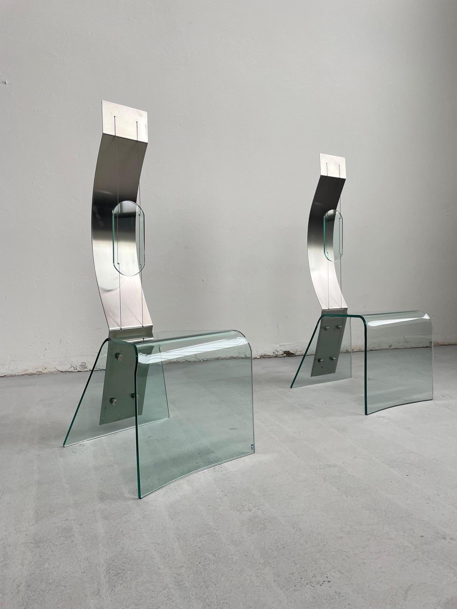 Unique statement piece, a high-back chair made of glass and steel. 
The chair was designed in 1998 by Italian architect Marco Baldanello and produced by Zeritalia

The chair is very beautifully crafted and features a seat constructed from a single
