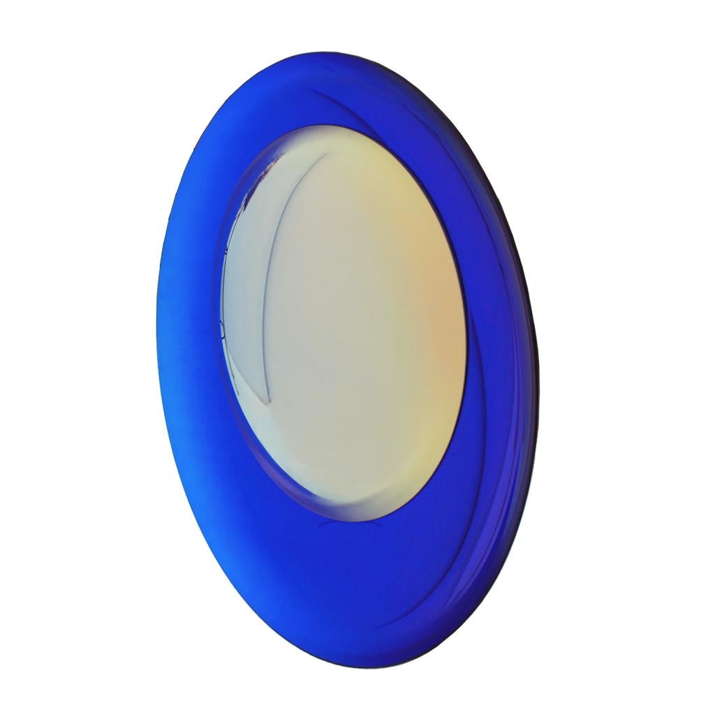 Modern sculptural beautiful concave French mirror. Wall hanging artwork handmade in blue night molded glass and a yellow lens. Finished with brass final details on the back to hang on the wall. Unique piece. Made in France.

Our main target is