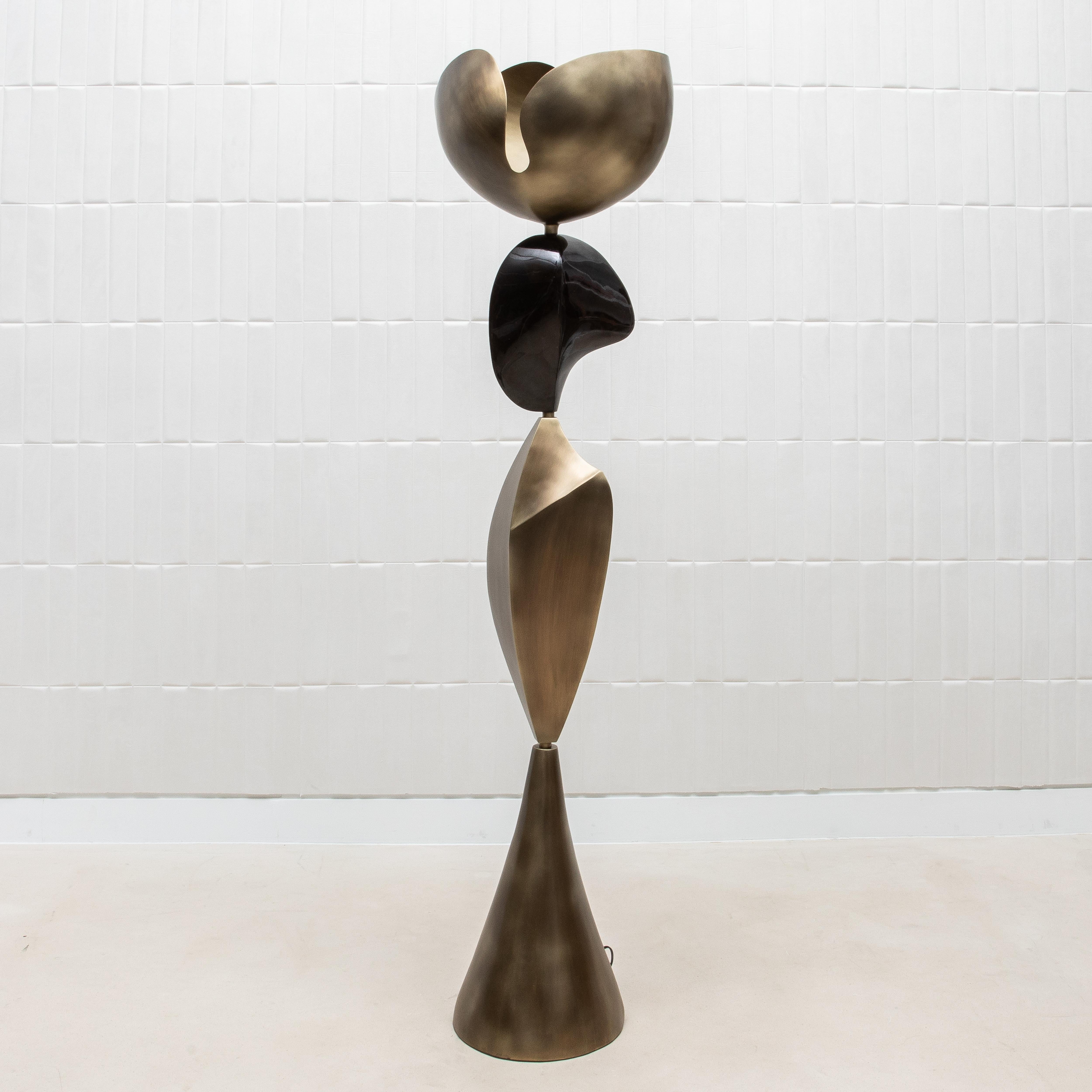 The Cosmo Sky Floor Lamp by KIFU Paris is a stunning piece of functional art, expertly handcrafted to embody timeless luxury and modern design. Its bold silhouette features a harmonious combination of bronze patina brass and black shell, creating a