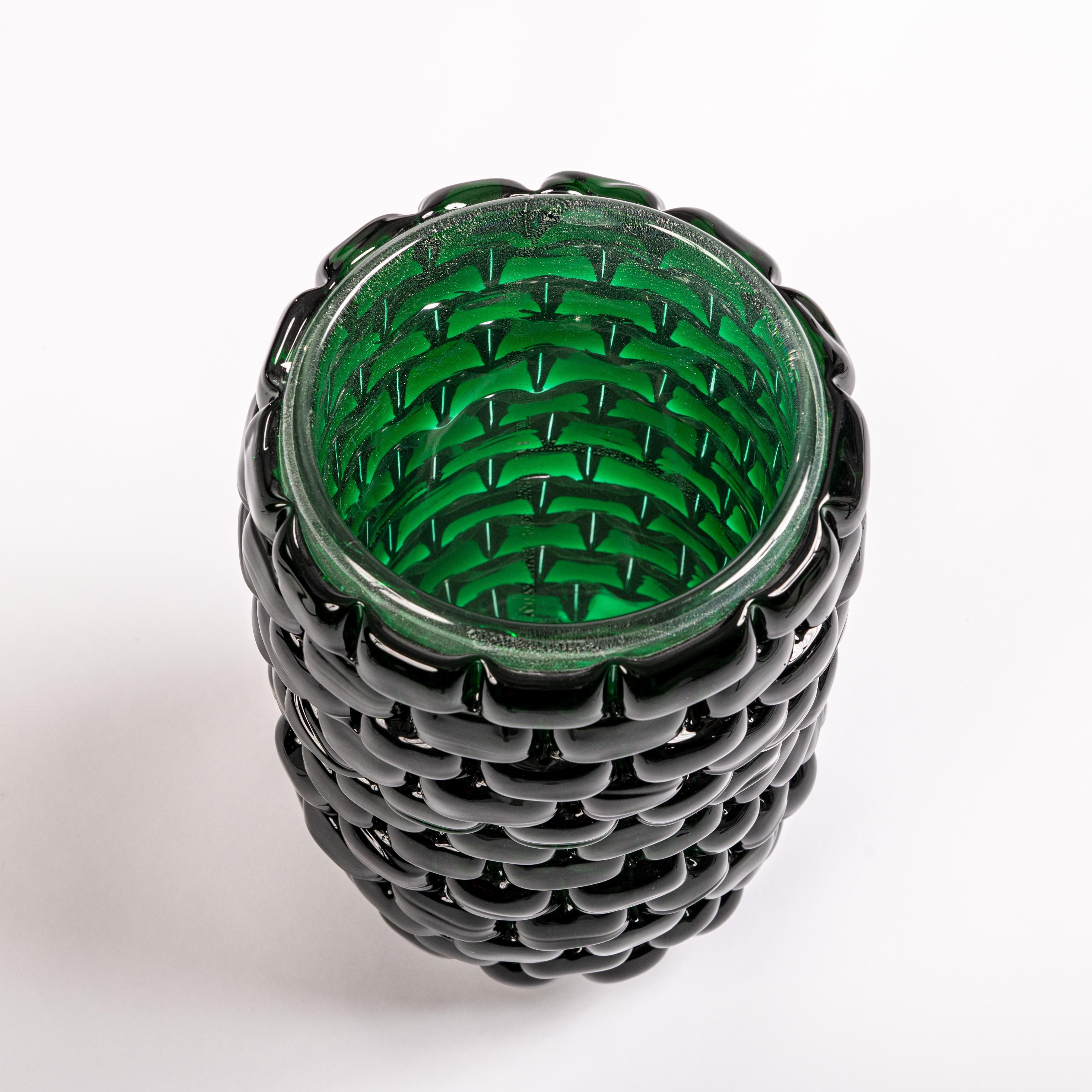 Contemporary venetian modernist vase signed cenedese with an interesting elongated modern organic shape, in a sophisticated 
bottle green color with sculptural interruptions that make the outside appear as if covered with stones - creating an