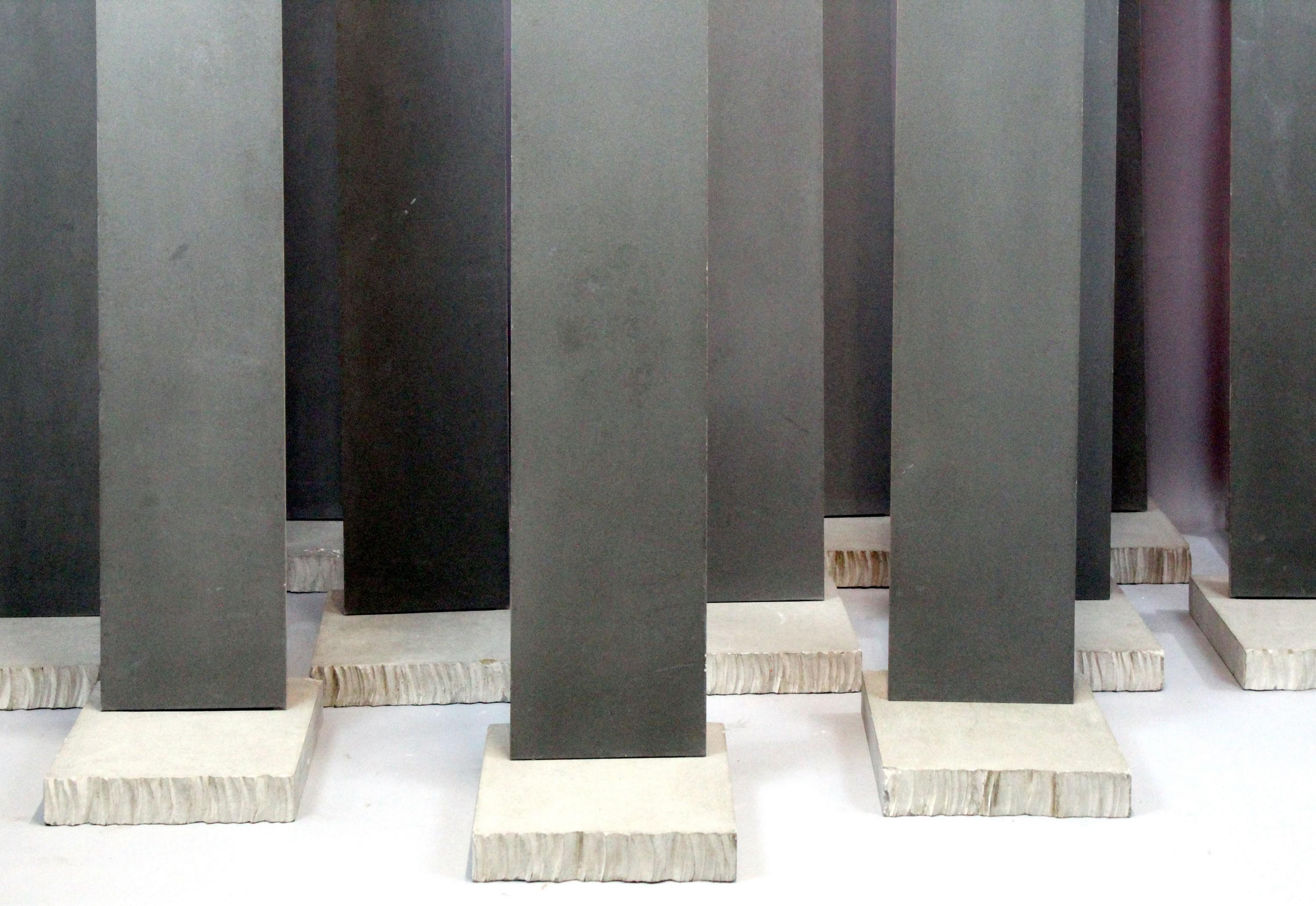 Installation composed of 14 steel blades and painted metal, on cut cement bases This installation was created for the Venice Biennale in 1988, for the Cure exhibition, by Alfredo Pirri The blades, all identical, can be arranged according to a