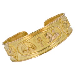 Modern Second-Hand 18 Karat Yellow Gold Egyptian Pattern Bangle Bracelet