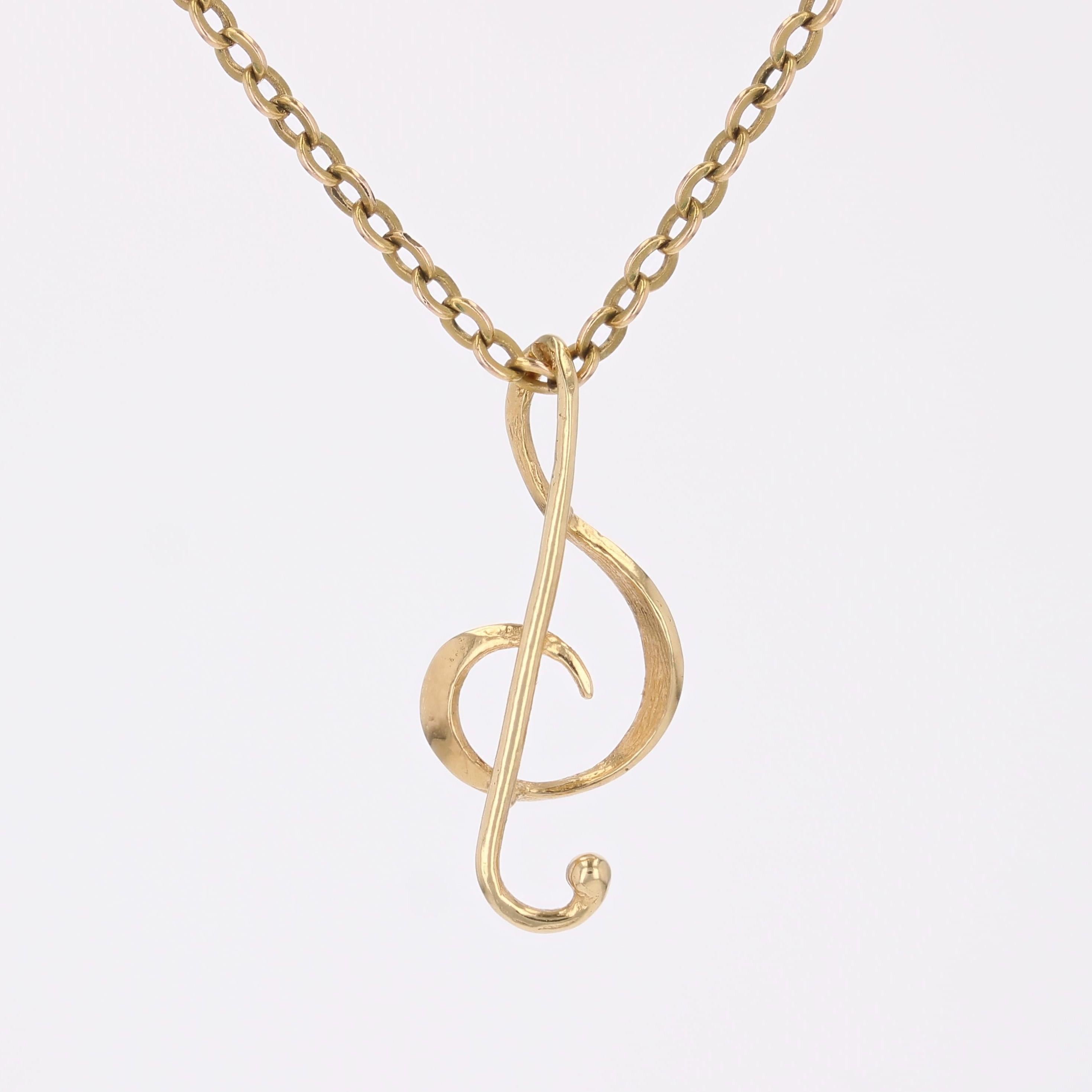 Moderne Pendentif moderne d'occasion en or jaune 18 carats avec breloque en forme de clé de sol en vente