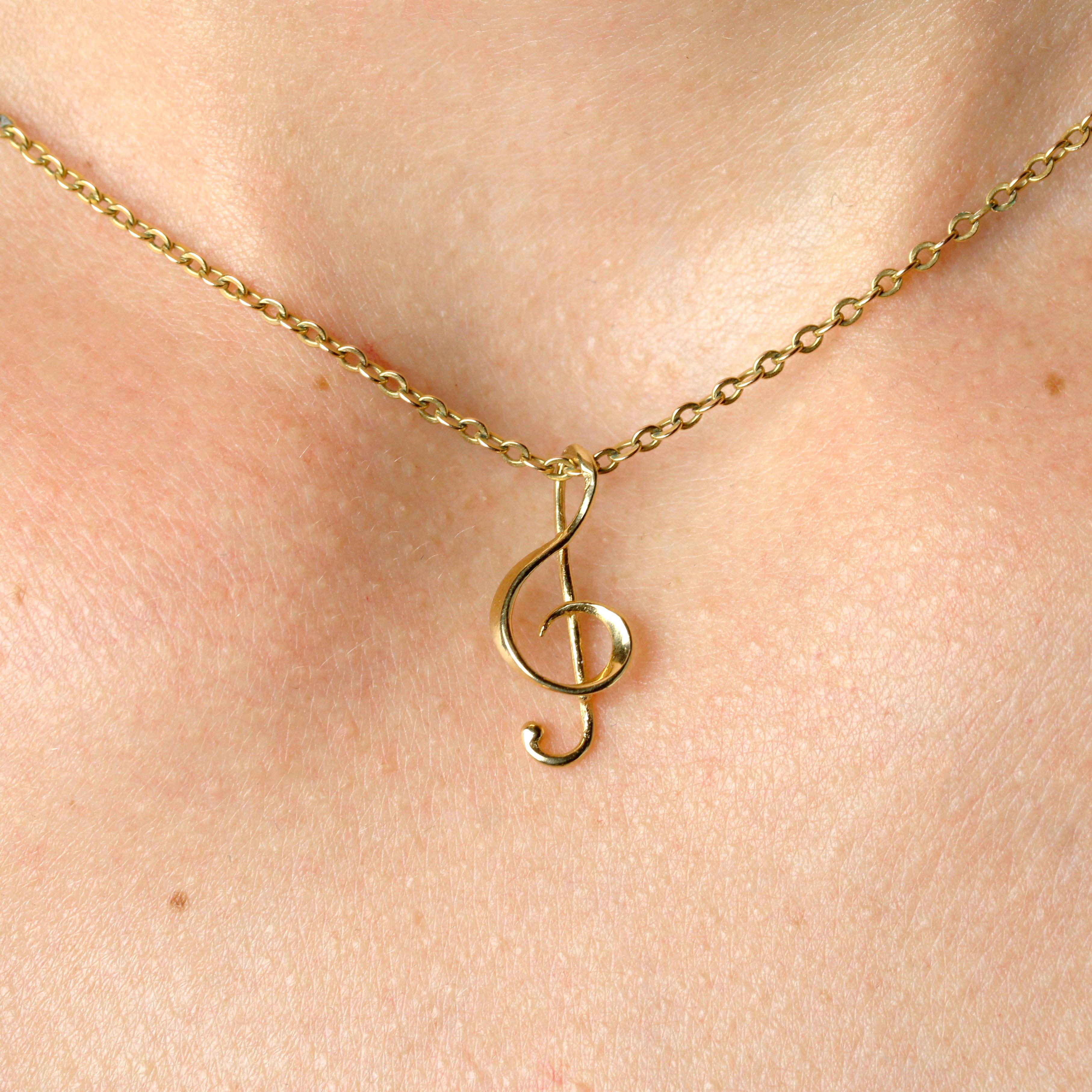 Pendentif moderne d'occasion en or jaune 18 carats avec breloque en forme de clé de sol en vente 2