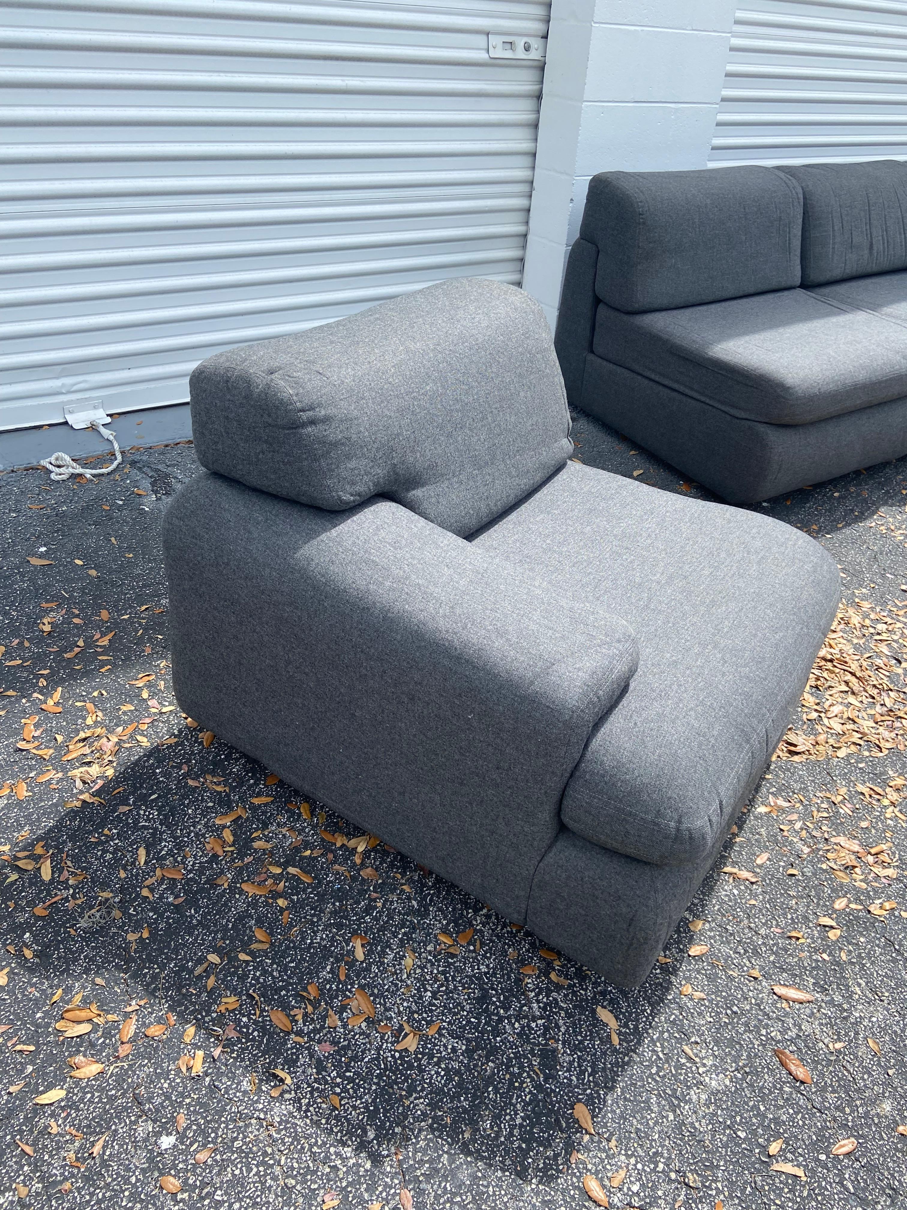 This is a fine Designed by the New York Design Institute five piece set to be configured many ways. Hand crafted GRAY flannel (does not need to be 
re-upholstered) 
having TWO one arm pieces and THREE armless pieces. From a penthouse estate in