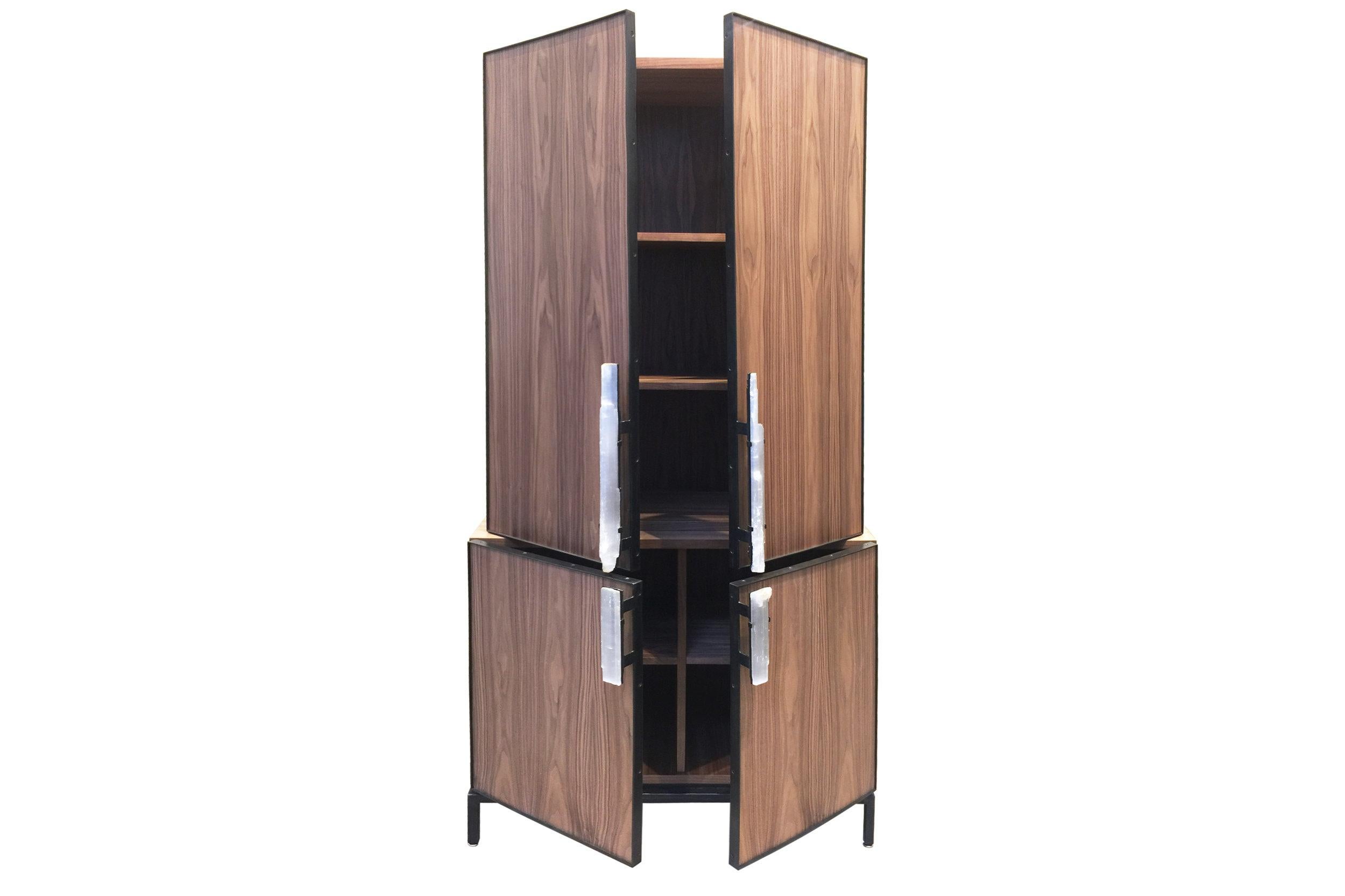 The Modern Selenite Bar Cabinet Ercole Home is crafted from Walnut with a Natural Finish, with a Natural steel base and Selenite handles. Custom sizes and finishes are available. 

Made in Brooklyn.