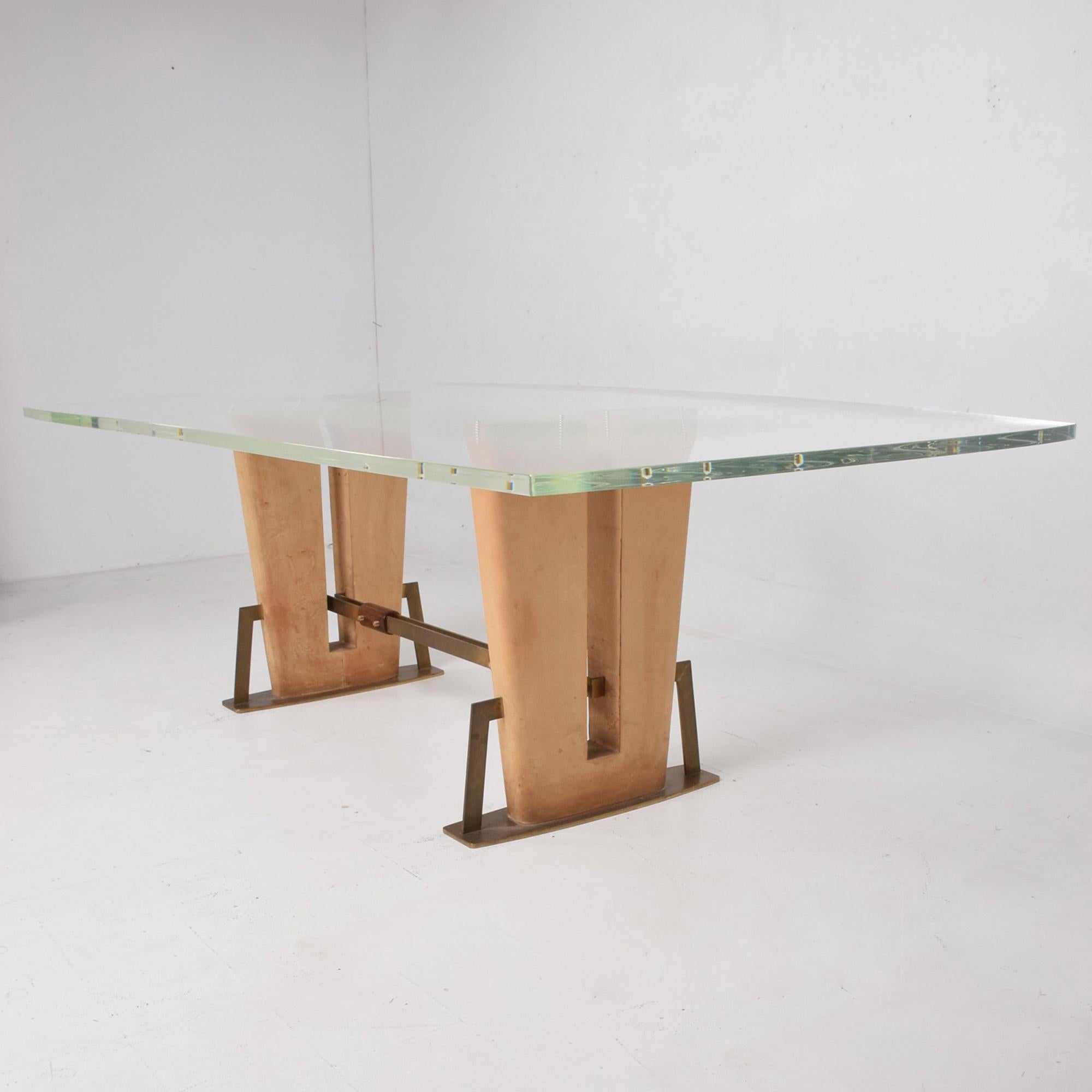 
Mexico 1960s exceptional Lucite Dining Table bronze angled leather base Mahogany and Solid Brass.
New Lucite tabletop has curved sides.
It is 1-inch-thick secured by eight (8) brass pegs.
Unsigned attribution is to Arturo Pani.
Please review all