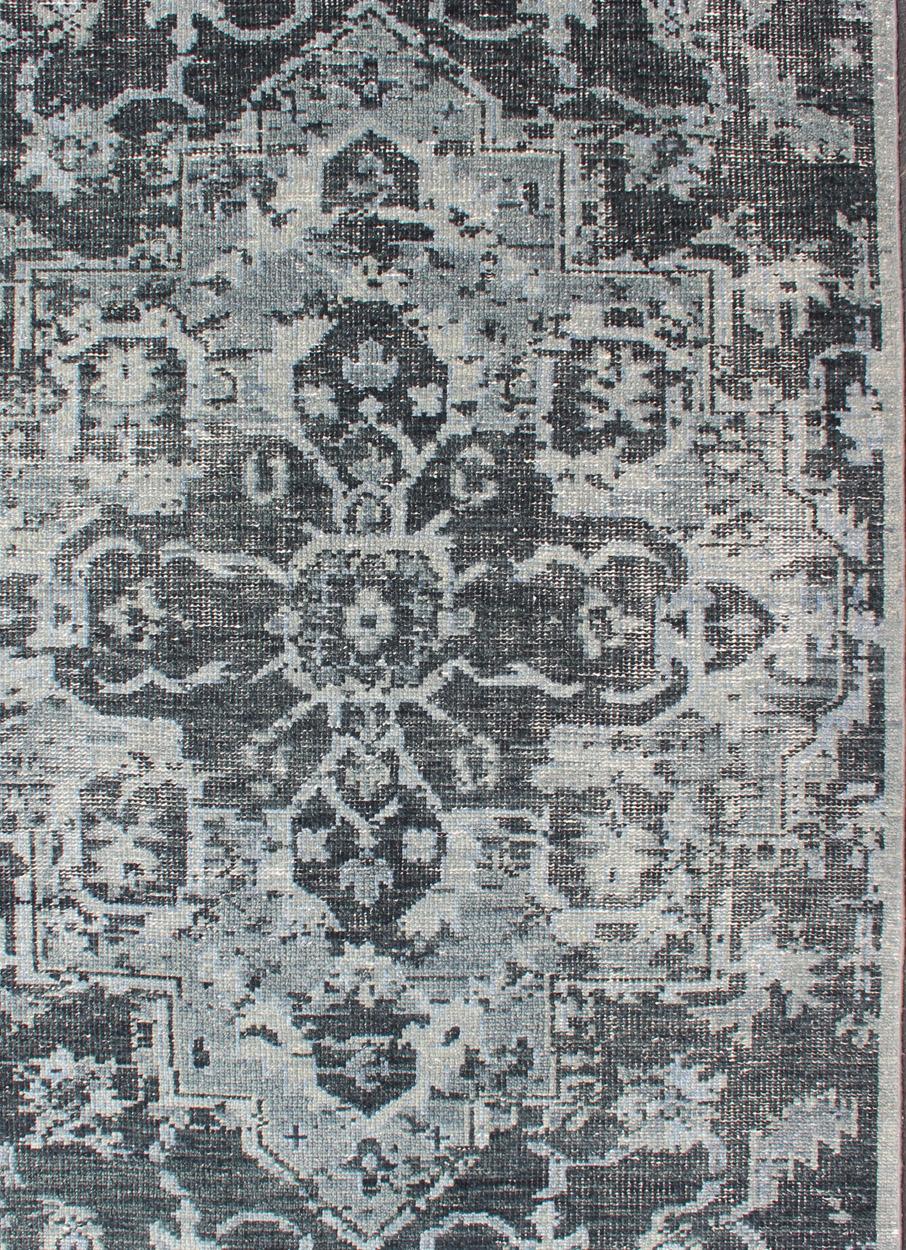 Persian Serapi design rug in modern colors such as Charcoal, blue, and gray geometric medallion design, Keivan Woven Arts/rug/OB-9551690, country of origin / type: India/ Oushak

Measures: 5' x 8'

This hand knotted Serapi design Indian rug features
