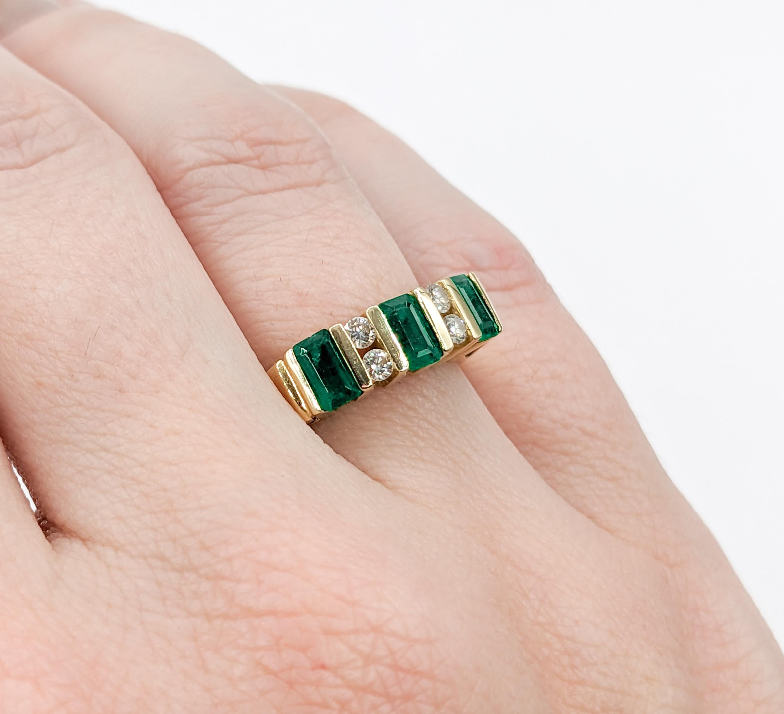 Modern Set Emerald & Diamond Band Ring

Discover classic elegance with this finely crafted ring, set in 14k yellow gold. It highlights a delicate .12ctw round diamond, radiating with SI2 clarity and a H-I color spectrum. Nestled alongside are three