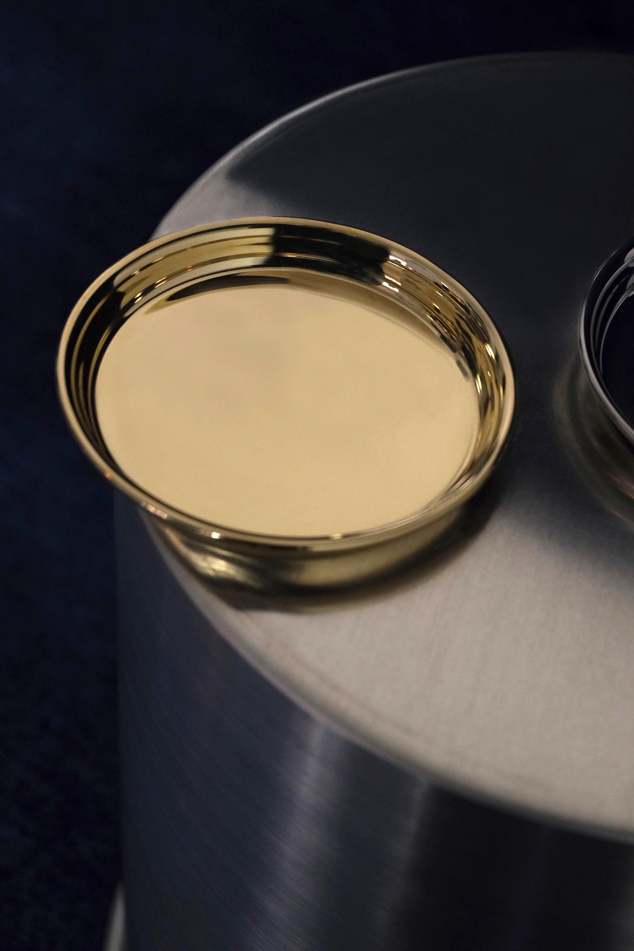 This set of six handcrafted brass coasters exemplifies contemporary Italian design through its minimalist lines and elegant materiality. Made from high-quality brushed brass, each coaster features the distinctive signature detail of the Rondelle