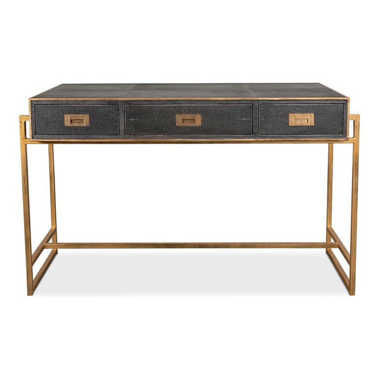 A modern shagreen embossed leather-wrapped desk with a brass tone iron-framed base. Three drawers with marbleized paper-lined interiors and with brass pull handles.

Dimensions: 49
