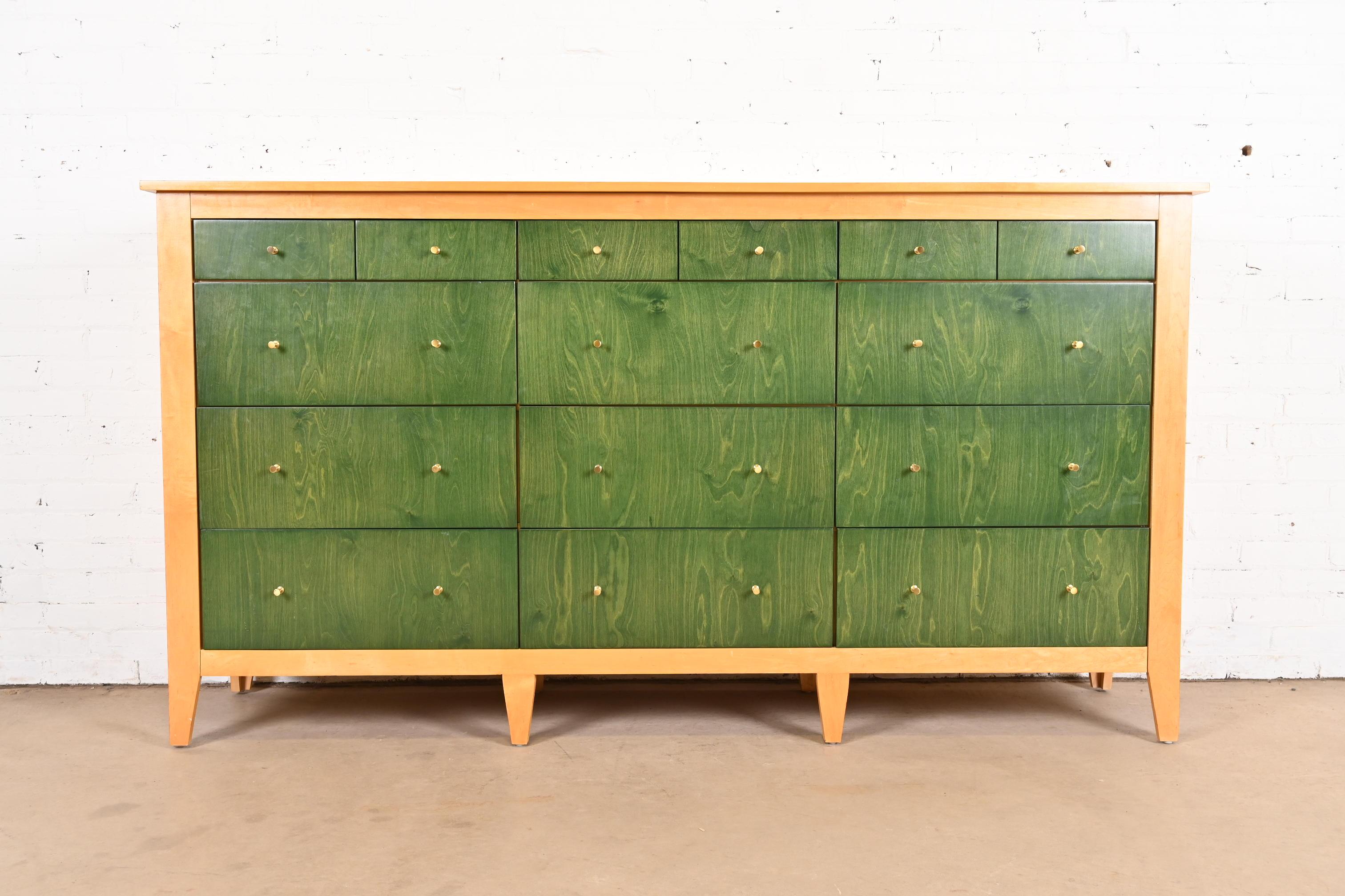A gorgeous Modern Shaker style twelve-drawer dresser

USA, Circa Late 20th Century

Natural maple case, with green stained maple drawer fronts and Paul McCobb style brass hardware.

Measures: 80