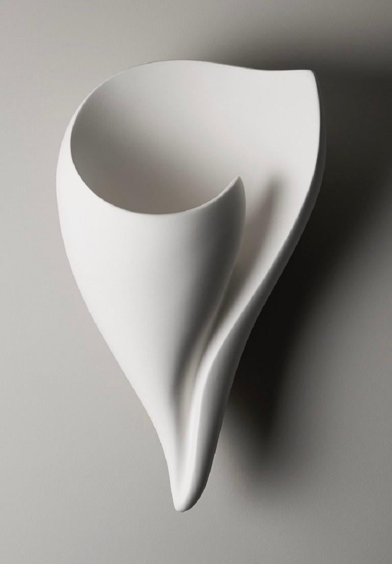 Handmade shell wall-mounted sculpture in silky smooth white plaster, created by artist Hannah Woodhouse in her London studio. Contemporary design inspired by nature and midcentury European sculpture. Height 15
