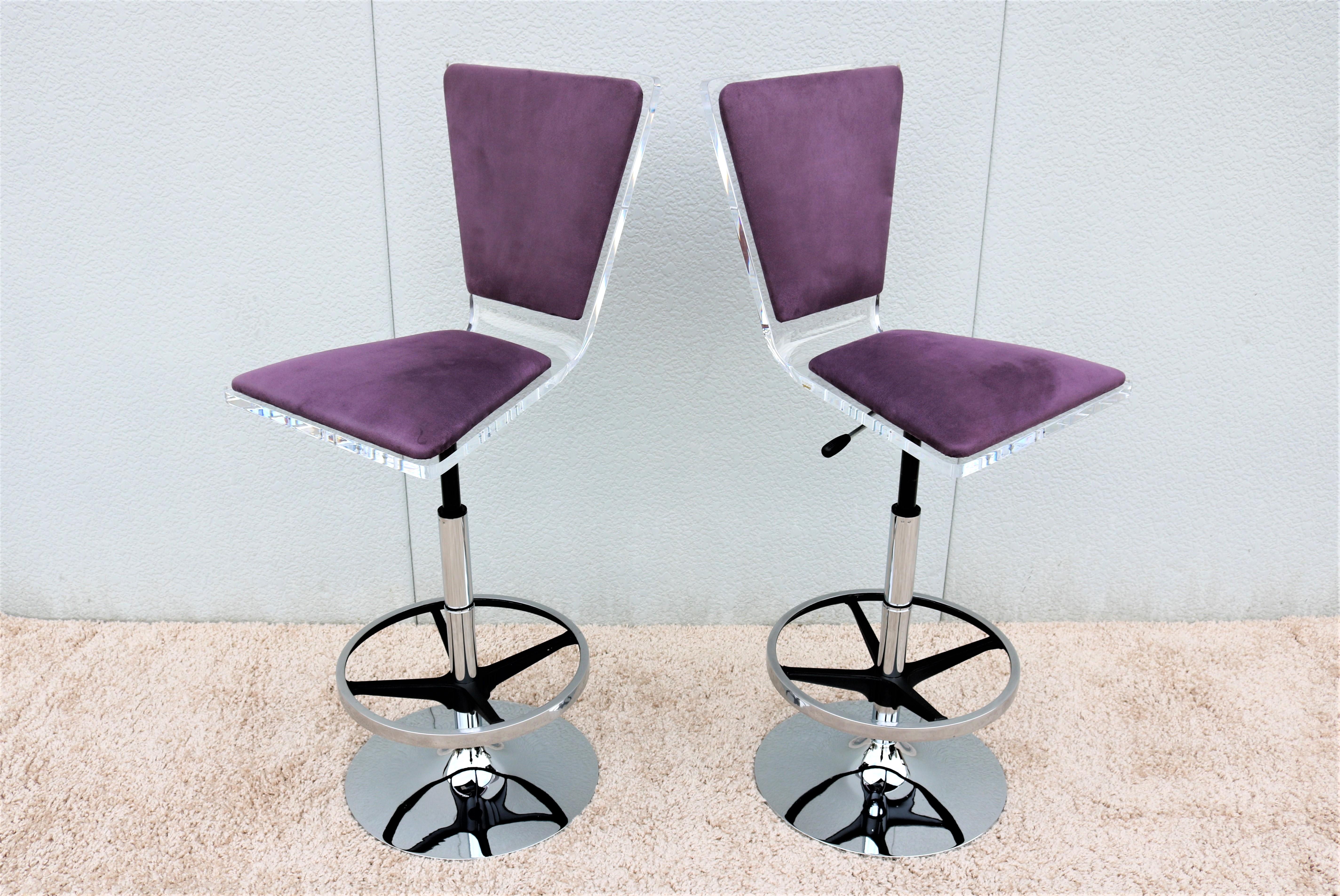 Stunning and elegant modern design pair of Trigo barstool. 
Distinguished by its acrylic one-piece triangulated back and seat design.
It features swivel and adjustable seat height and can be used as a counter stool or bar stool. 
Looks absolutely